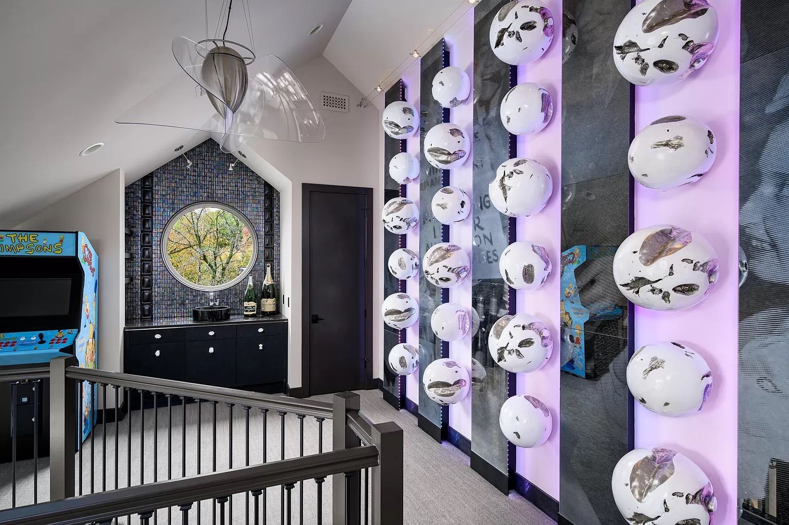 A hallway with purple walls and white balls.