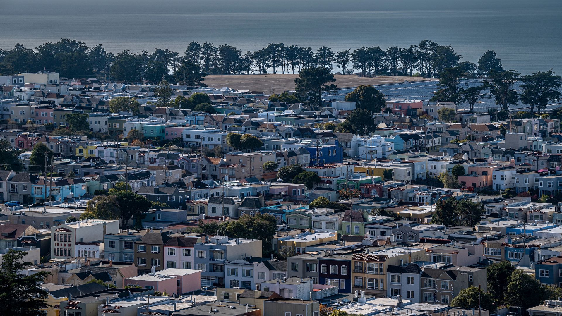 Photo of San Francisco homes next to an ocean coastline