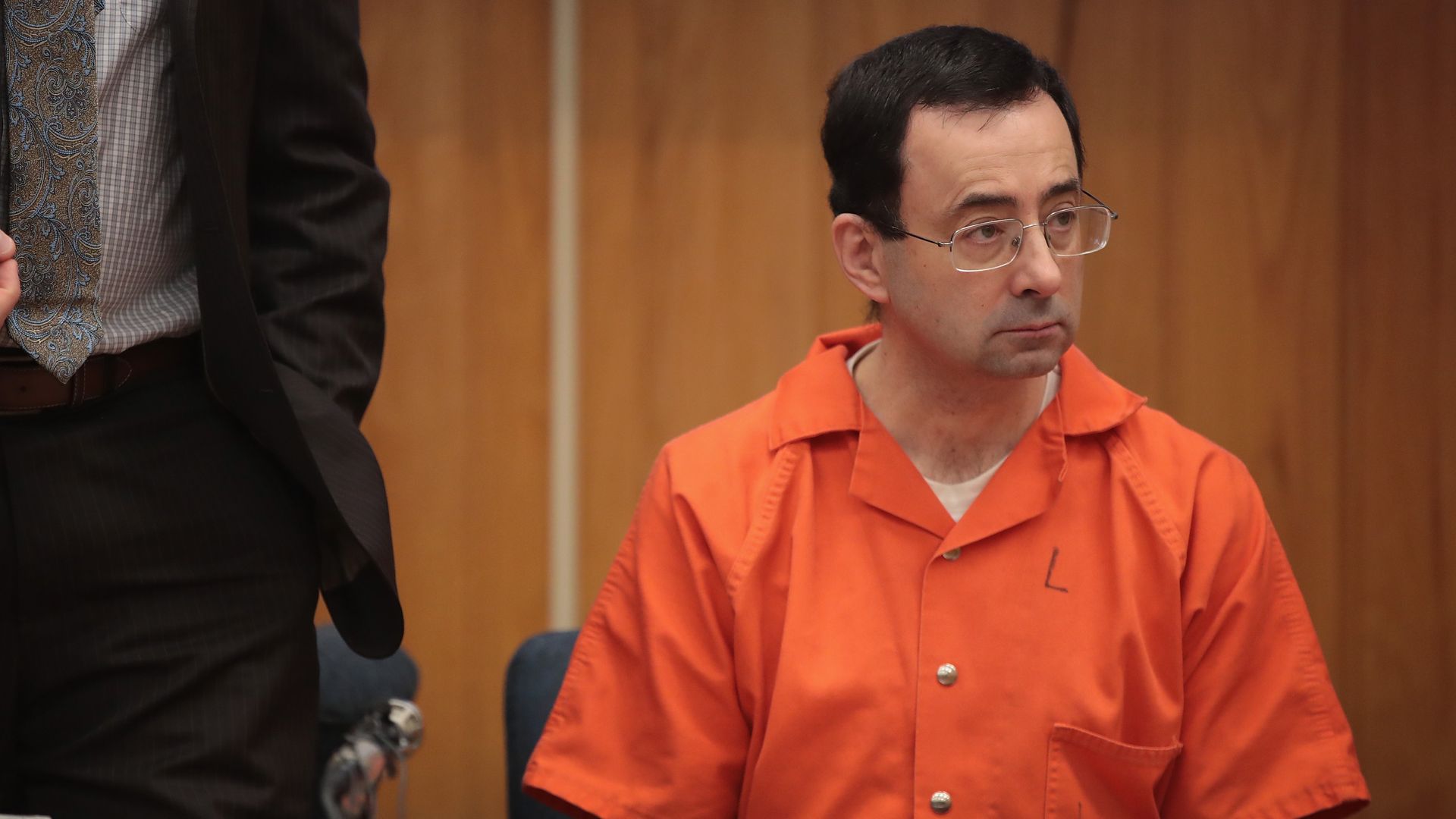 Larry Nassar sits in court listening to statements before being sentenced for three counts of criminal sexual assault on February 5, 2018 in Charlotte, Michigan