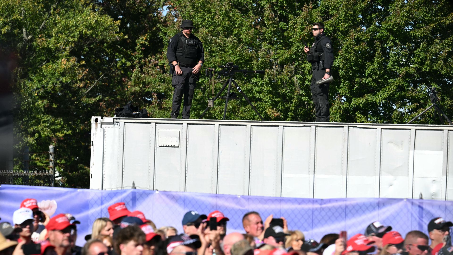US Secret Service snipers stand on a roof ahead of former President Trump's October rally in Butler, Pennsylvania.
