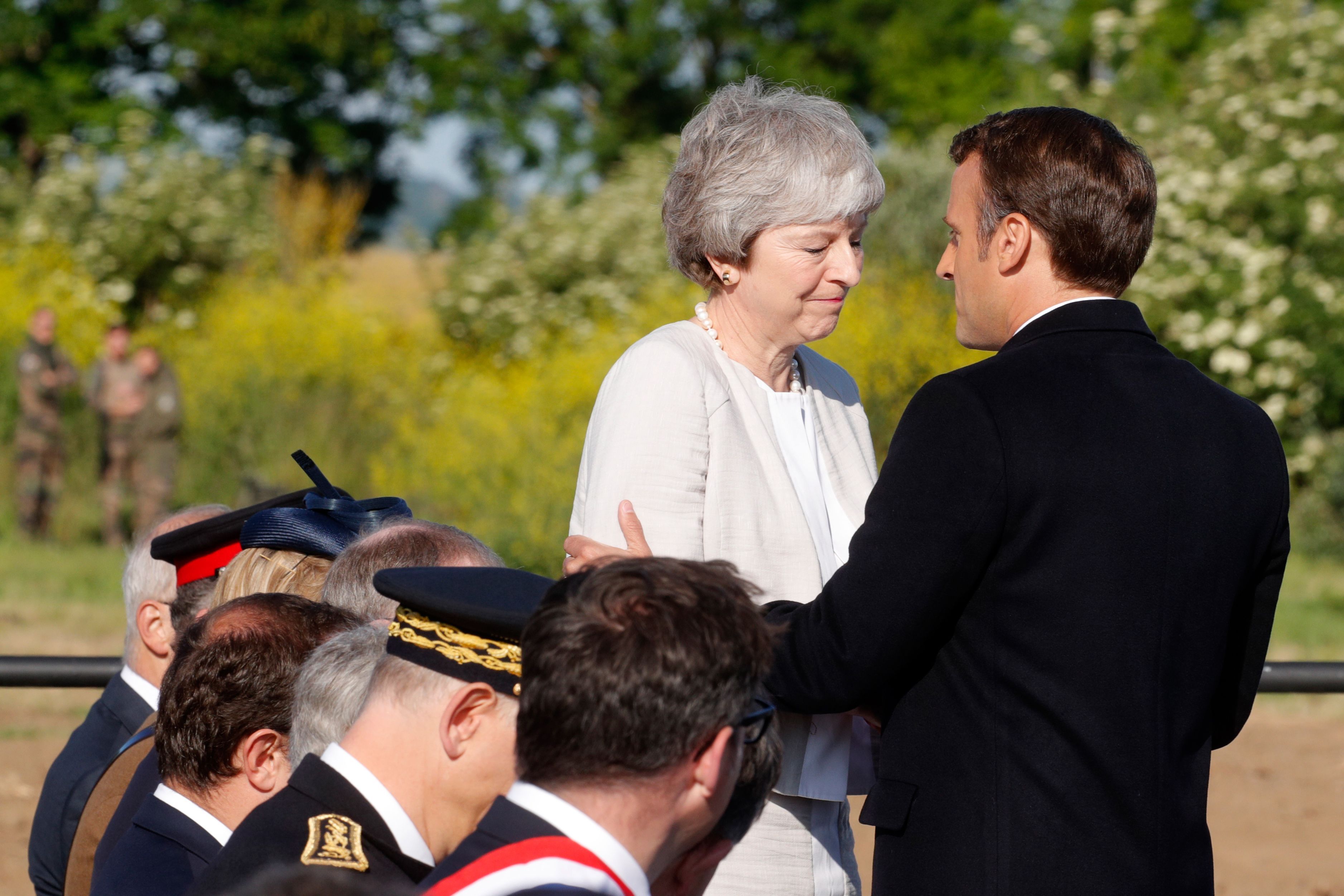 French President Emmanuel Macron greets British Prime Minister Theresa May.