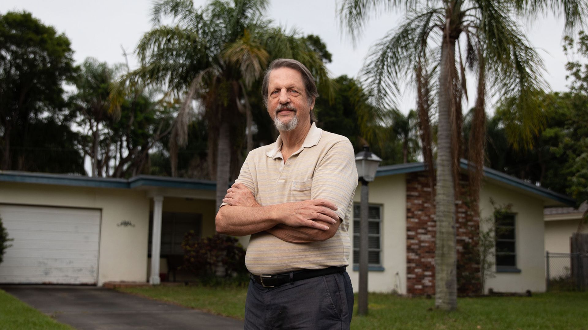 Jim Ficken in front of his Dunedin home