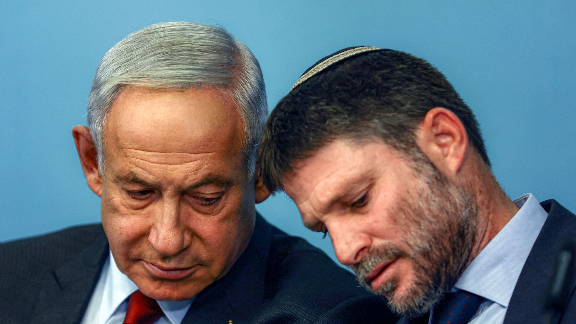 Israeli Prime Minister Benjamin Netanyahu (left) and Finance Minister Bezalel Smotrich attend a press conference at the Prime Minister's office in Jerusalem on January 25, 2023. 