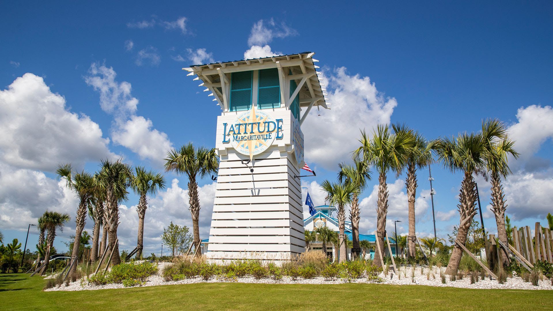 A photo of palm trees and the signage outside of Latitude Margaritaville.