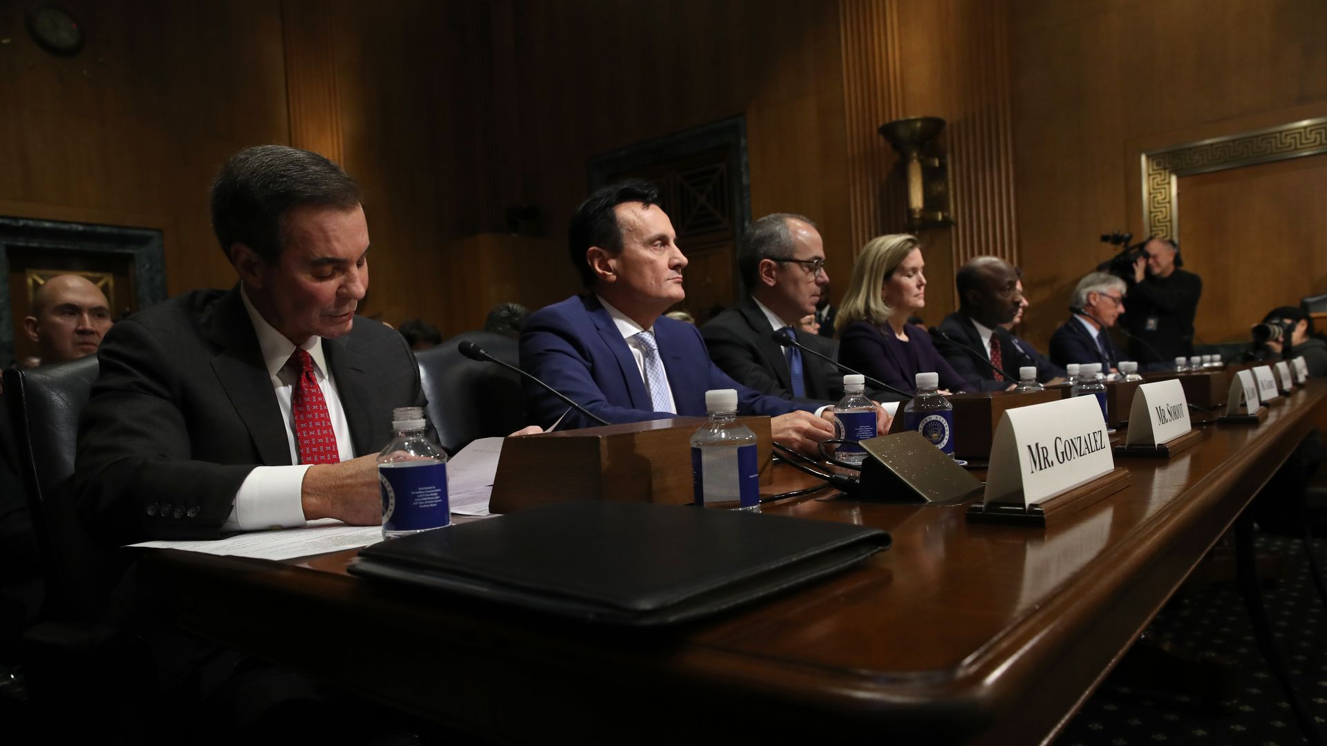 The executives 7 pharmaceutical companies sit at a table in front of the Senate.