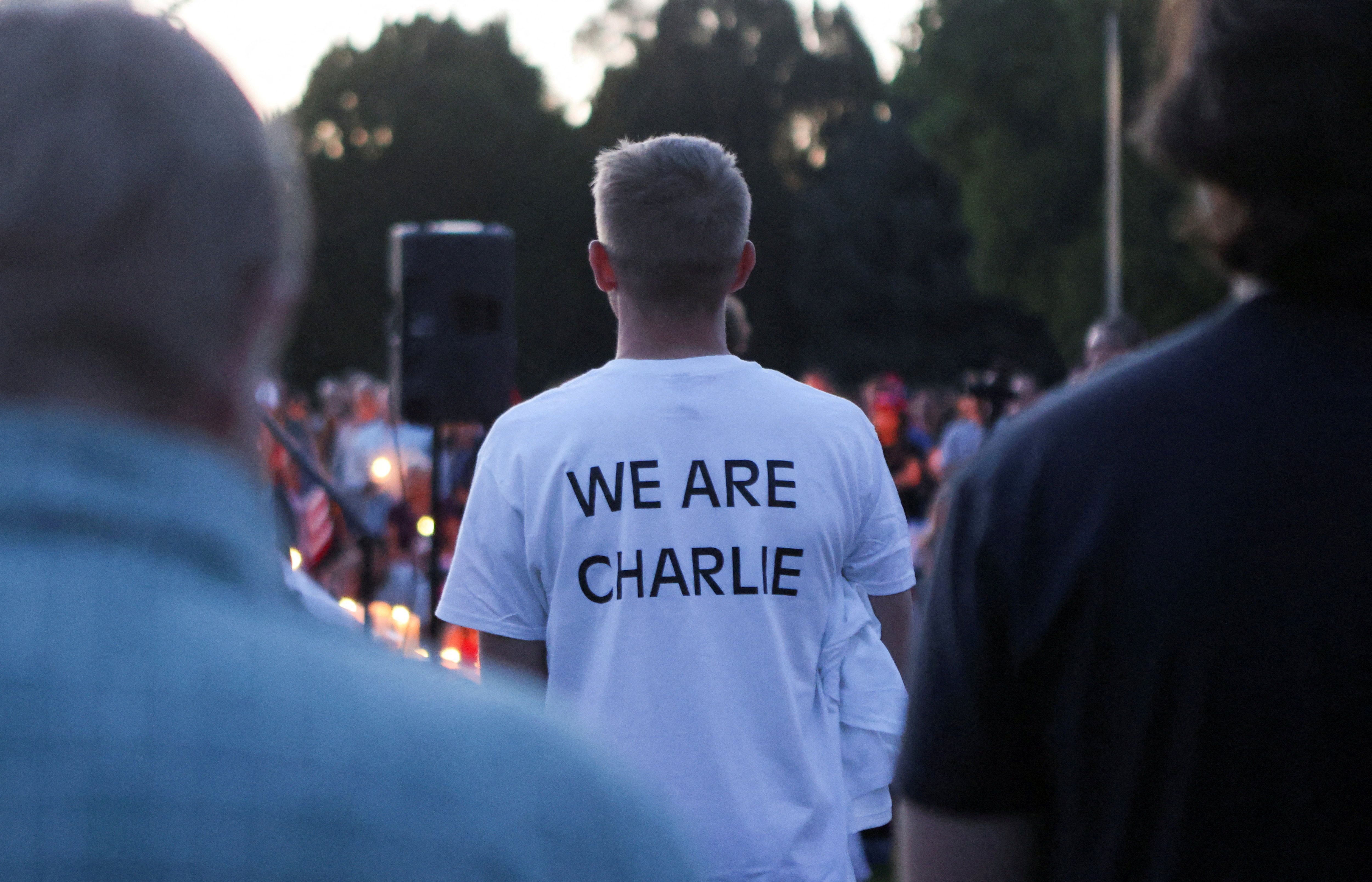 A man wears a shirt reading "WE ARE CHARLIE"