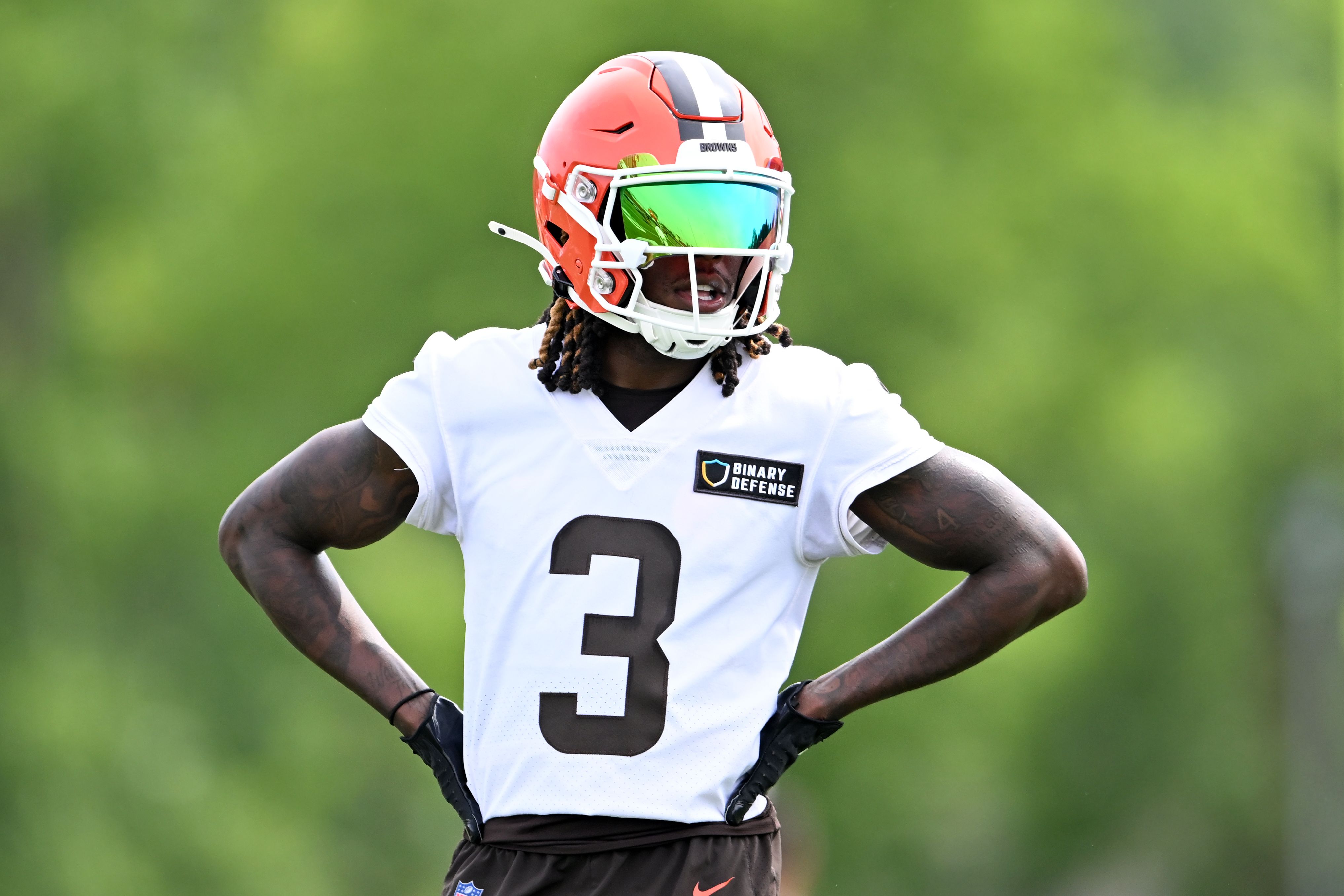 Cleveland Browns football player Jerry Jeudy stands in uniform with his hands on his hips.