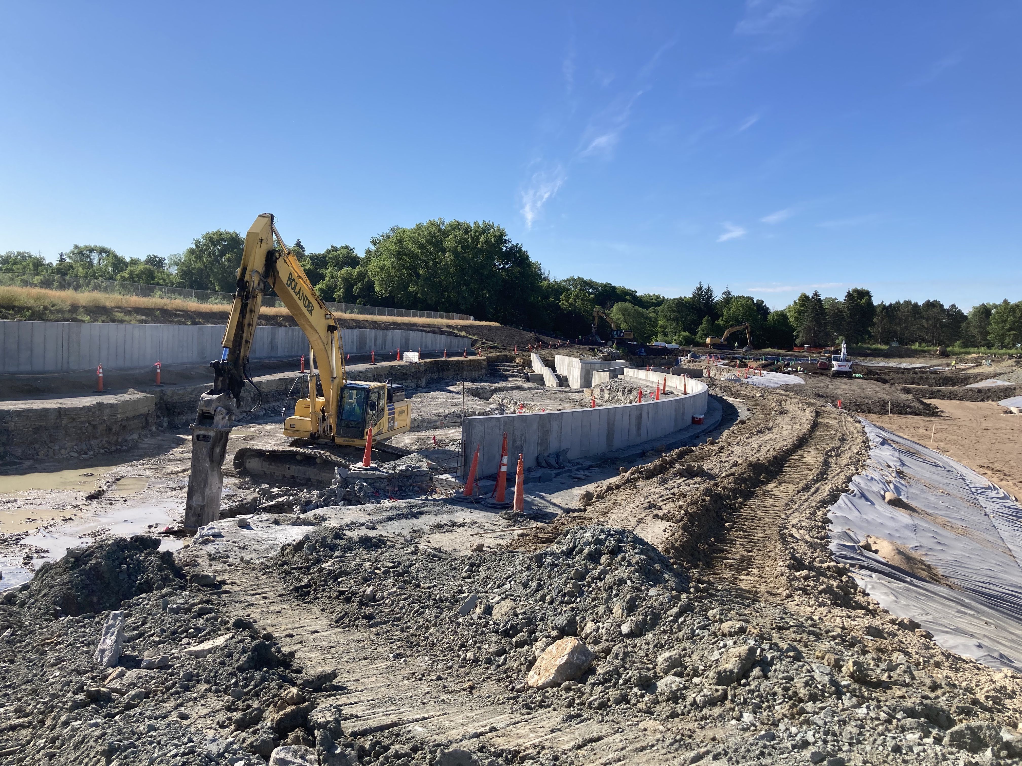 An excavator creates a new creek in St. Paul's Highland Bridge development.