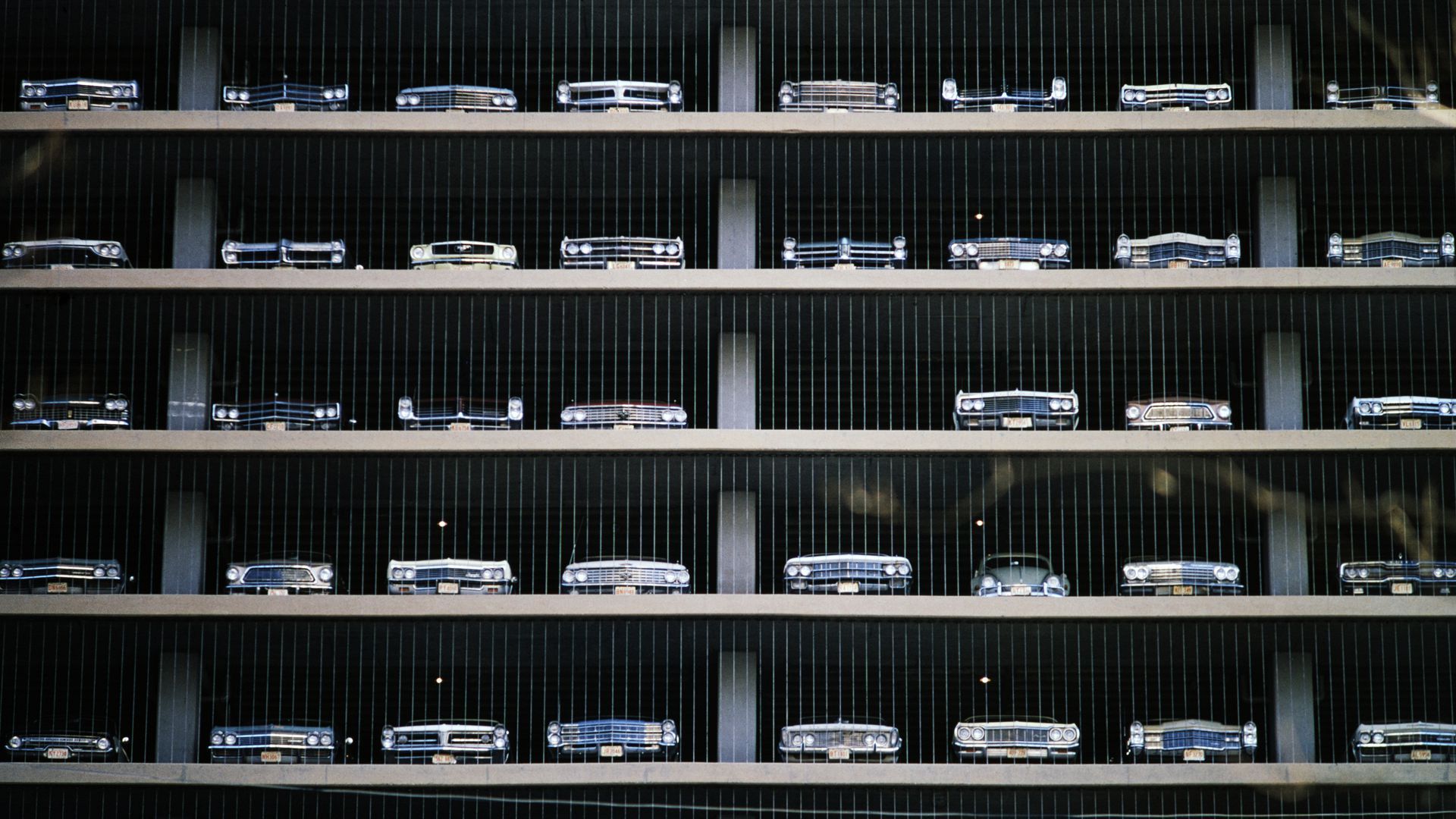 image of a parking garage with many cars