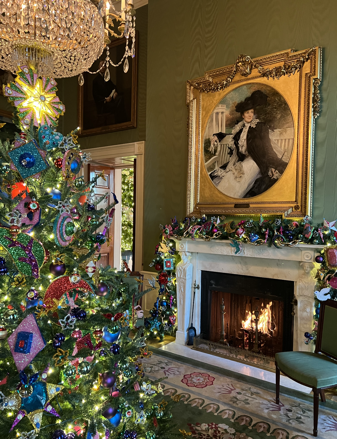 The Green Room's Christmas tree features colored glass ornaments.