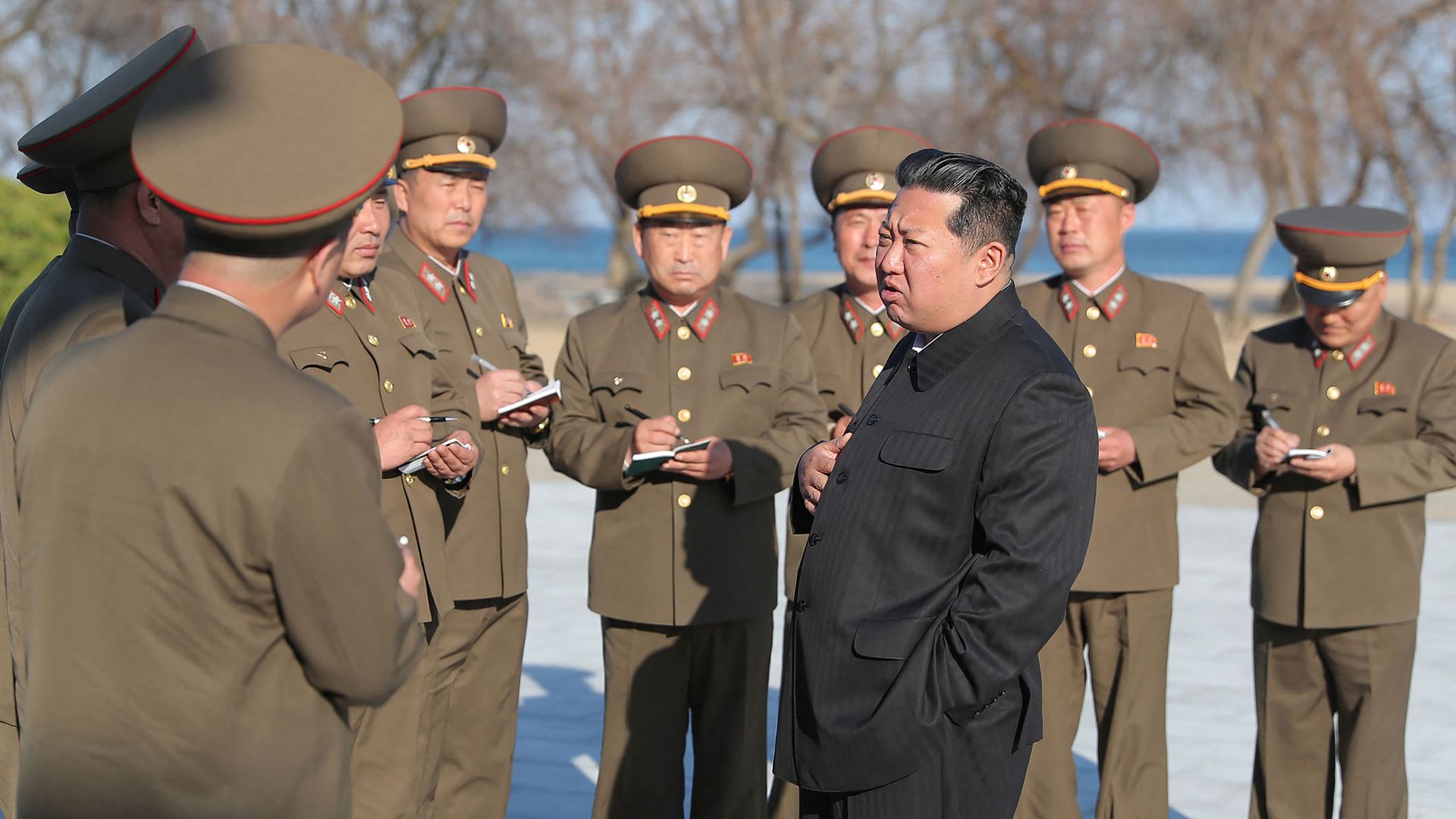 This undated handout picture released from North Korea's official Korean Central News Agency (KCNA) on April 17, 2022 shows North Korean leader Kim Jong Un with military members in North Korea.