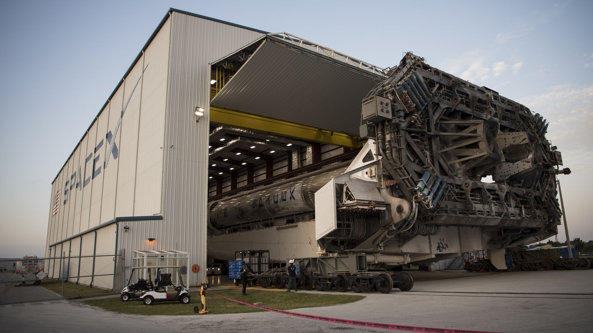 Photo of a rocket being rolled into a SpaceX facility