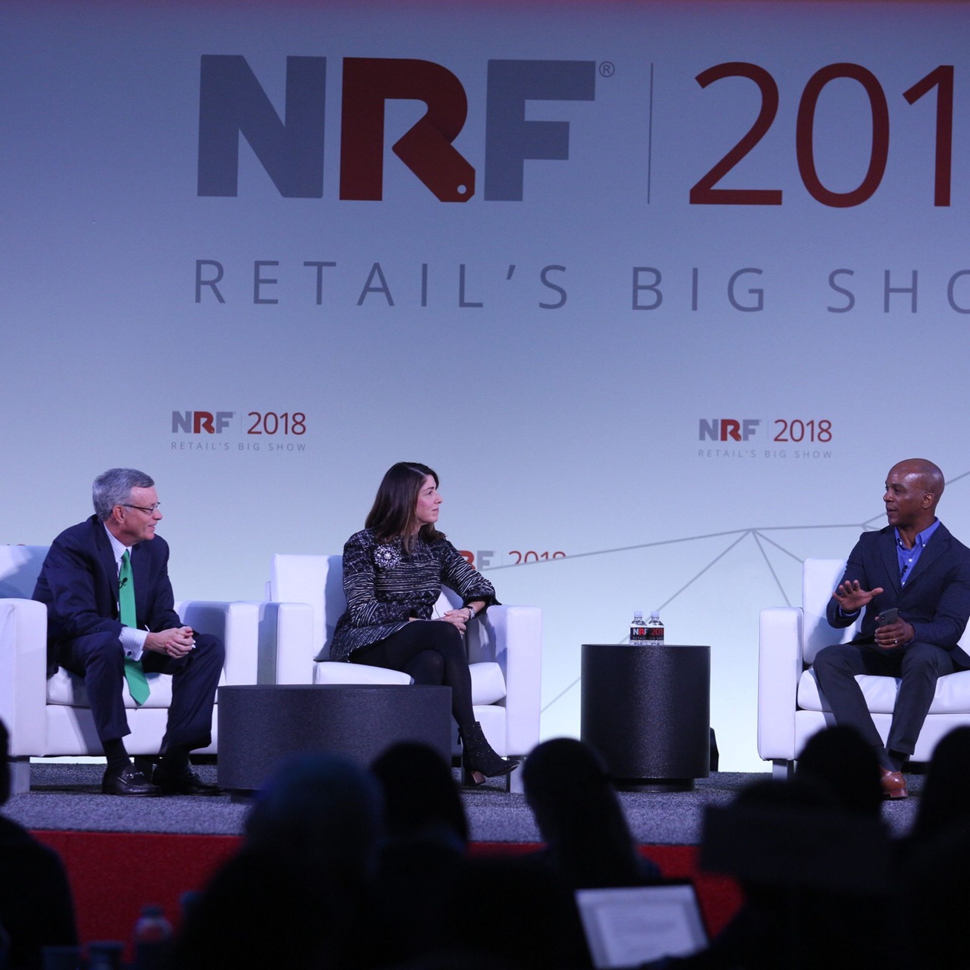Visa CEO Al Kelly, Neiman Marcus CEO Karen Katz, and CNBC's Jon Fortt speak onstage at the National Retail Federation's Big Show Conference.