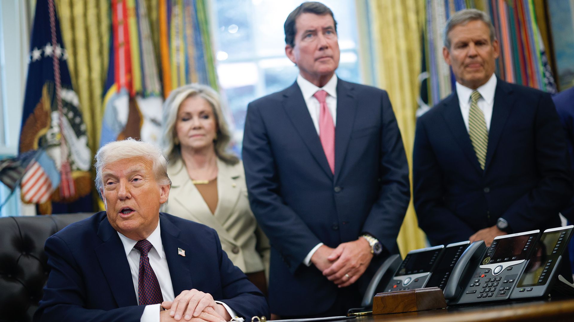 A sitting President  Trump in the White House moments before signing a presidential memorandum on Memphis, Tenn., in September, as Tennessee Sens. Marsha Blackburn (left) and Bill Hagerty and Tennessee Gov. Bill Lee, all standing behind him, look on.