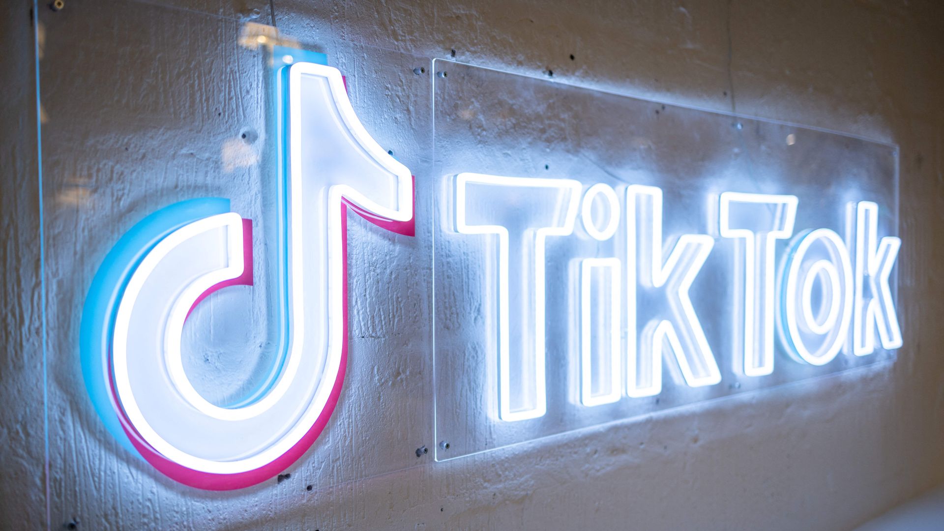 Image of TikTok in lights on a wall