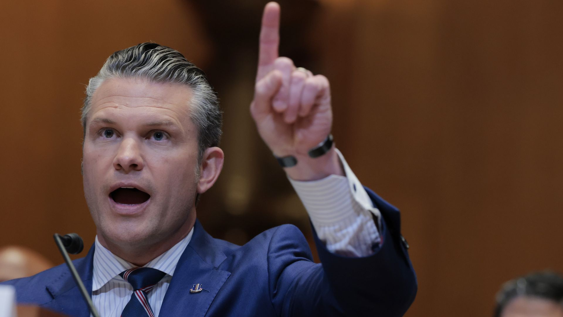 Defense Secretary Pete Hegseth points index finger during a congressional hearing