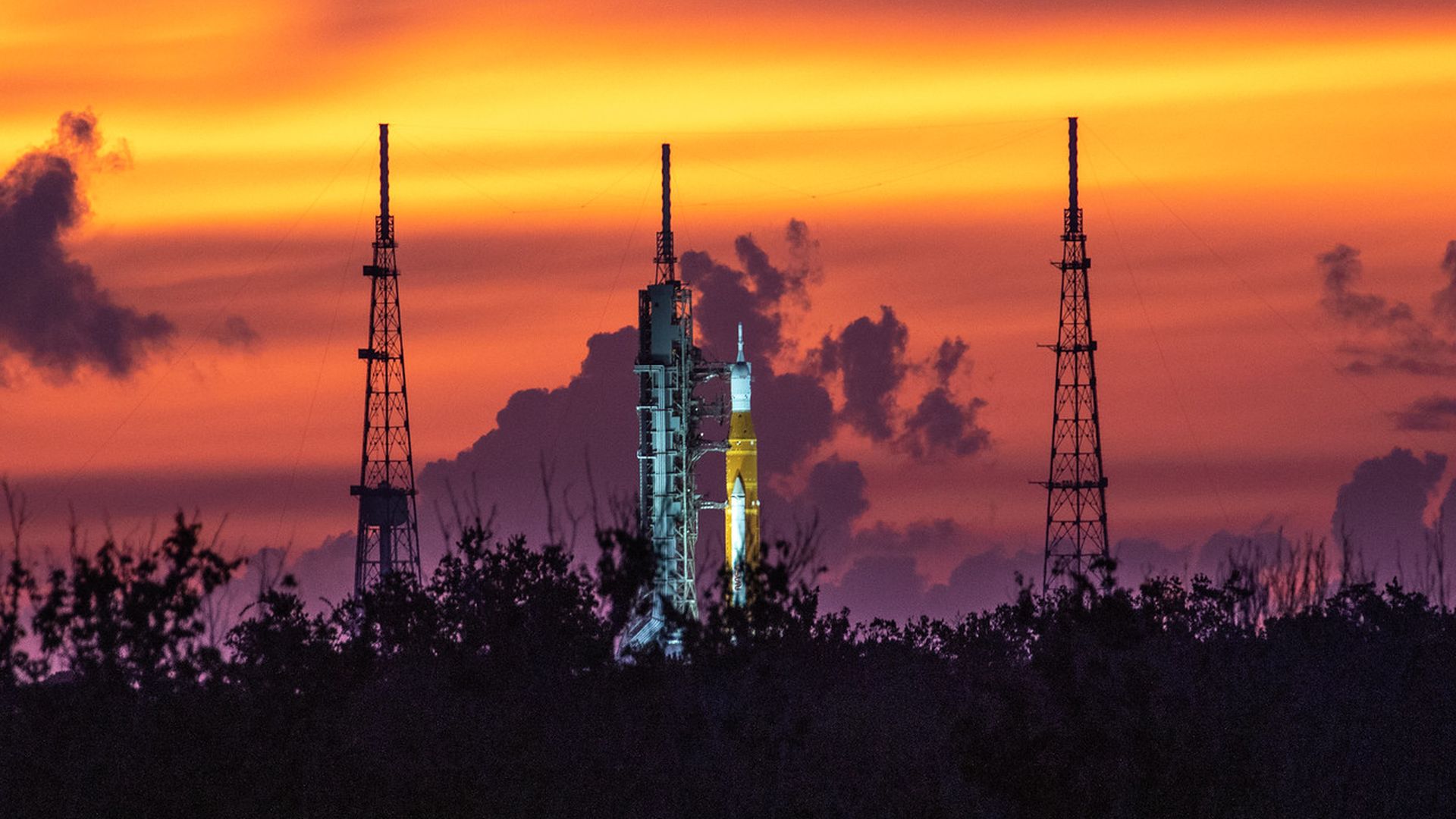 A sunrise photo of the Space Launch System rocket on the launch pad