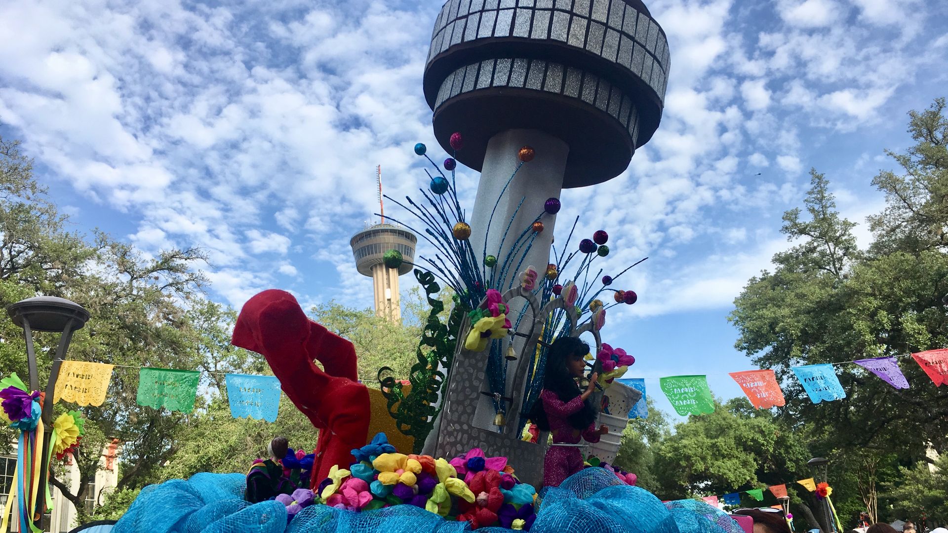 A view of the Tower of Americas with a miniature version of the landmark.