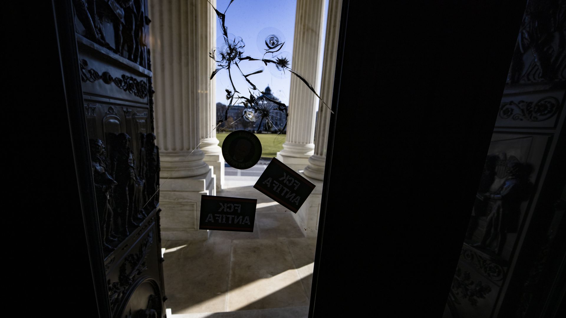Image of taped-up bullet holes at the U.S. Capitol following protests there 1/6/21.