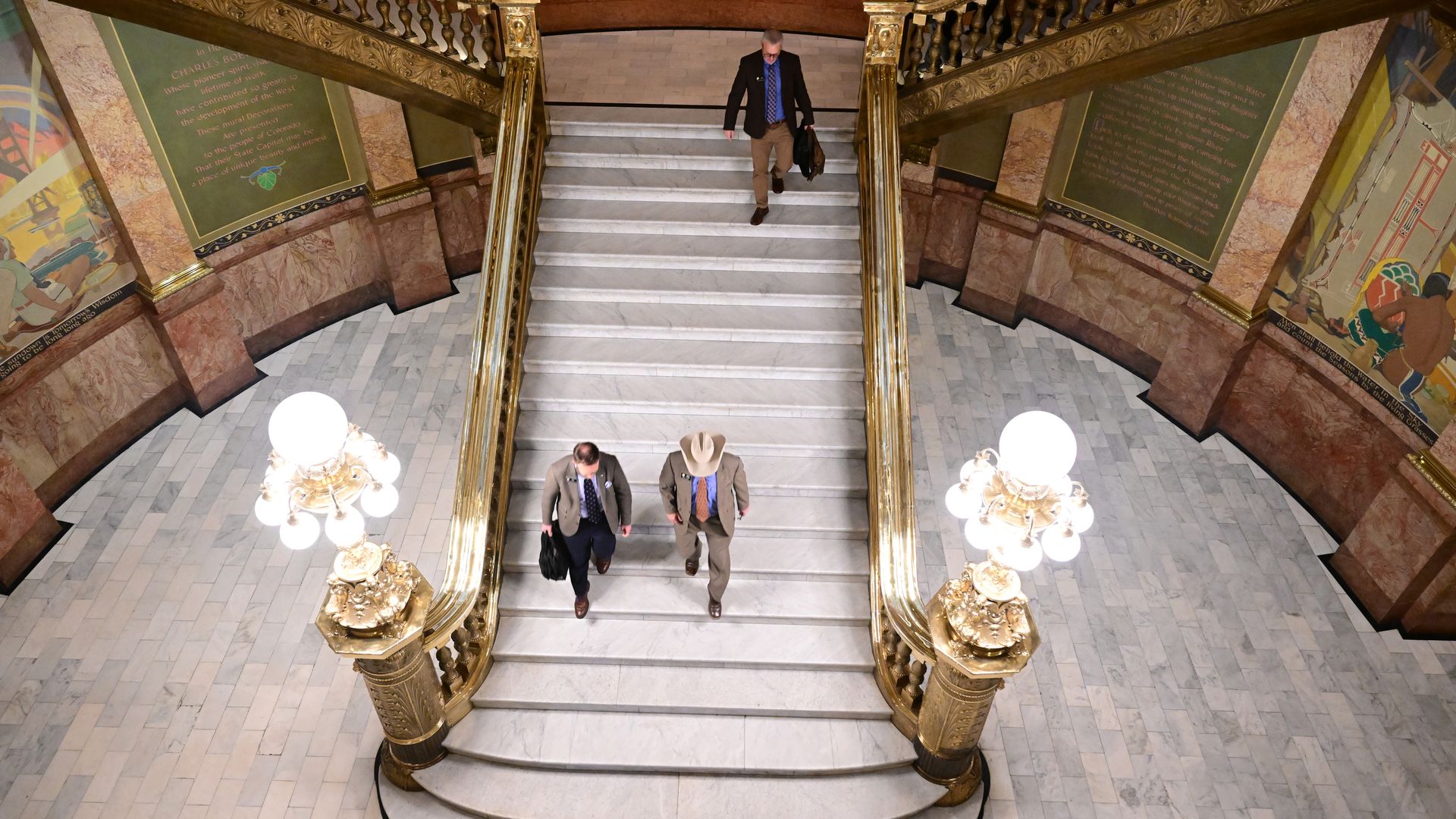 Republican Minority Leader Mike Lynch, in cowboy hat, and State representative Matt Soper, left, walk out of the Capitol on Monday evening in protest. Photo: Helen H. Richardson/Denver Post via Getty Images