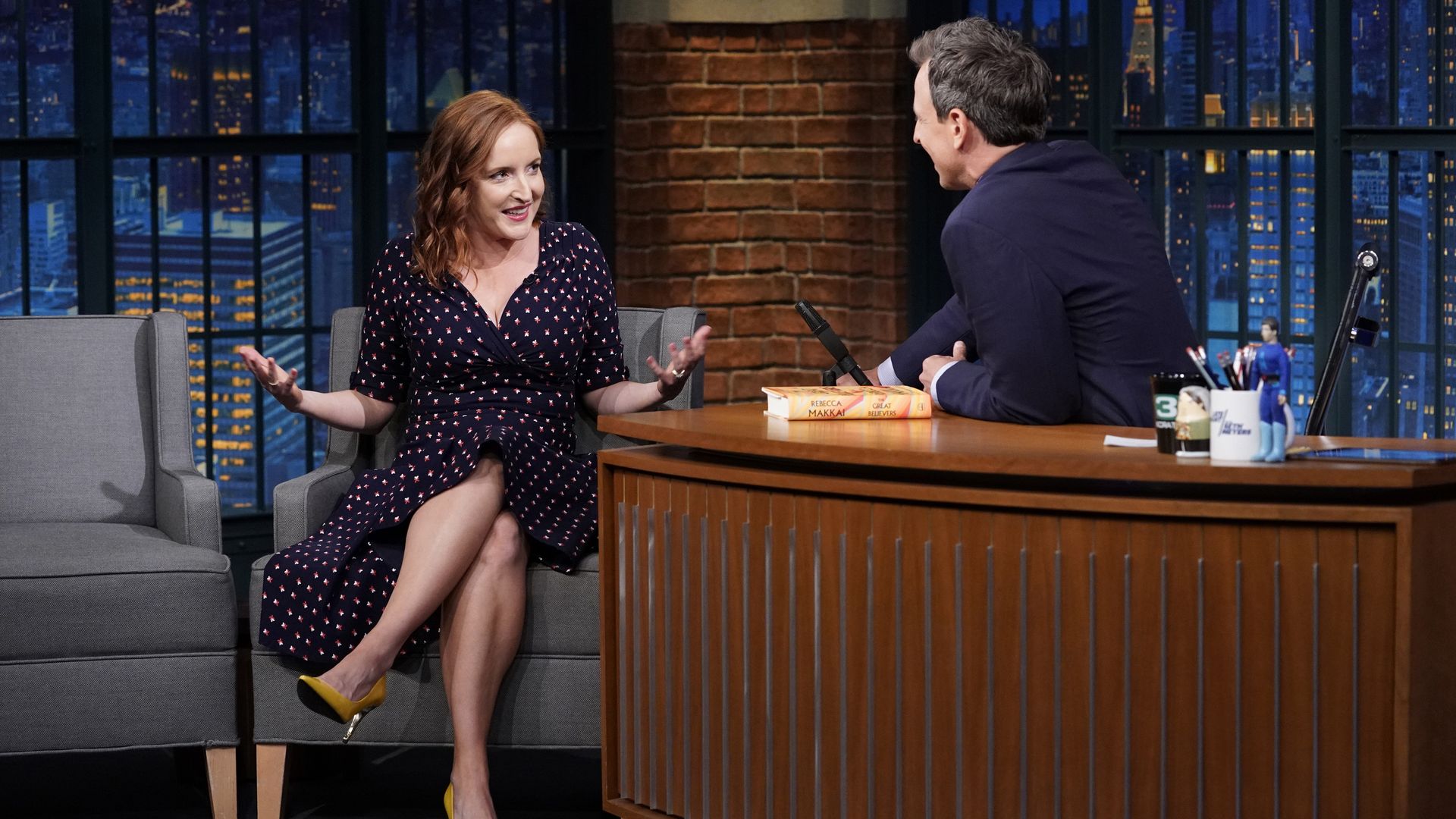 Photo of woman being interviewed on a talk show. 