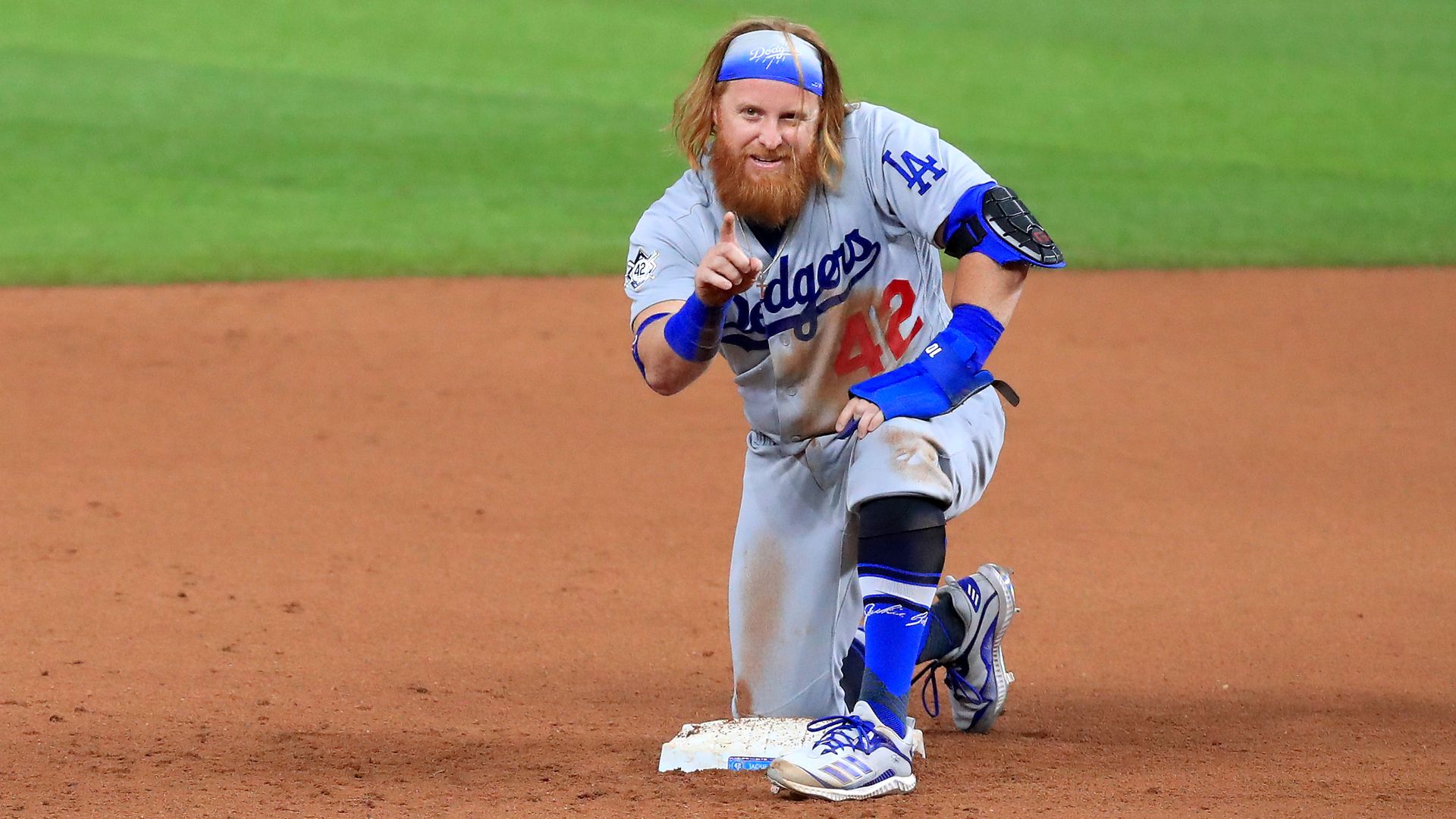 Justin Turner points at camera