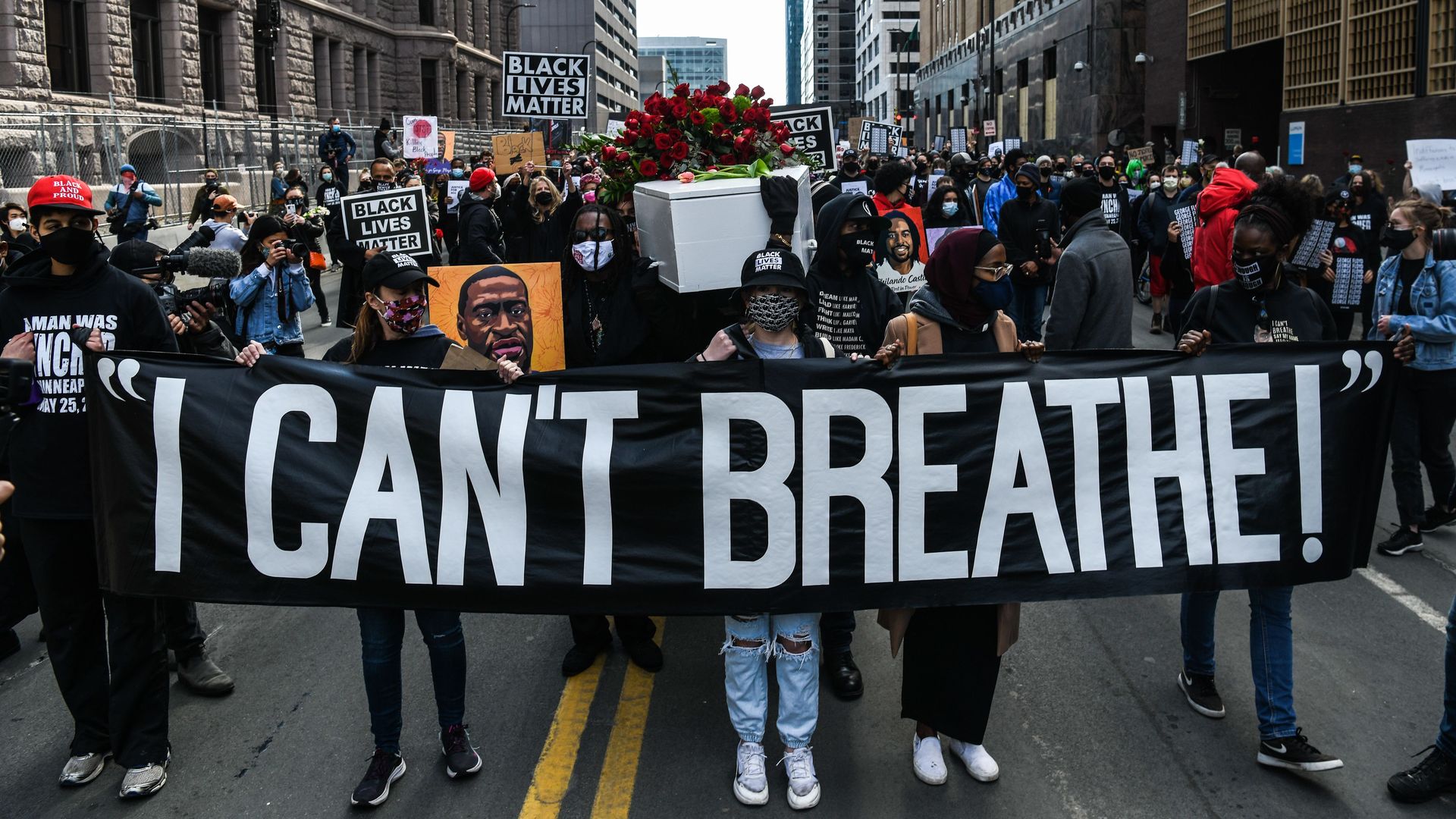 Demonstrators march outside the Hennepin County Government Center in Minneapolis, Minnesota.