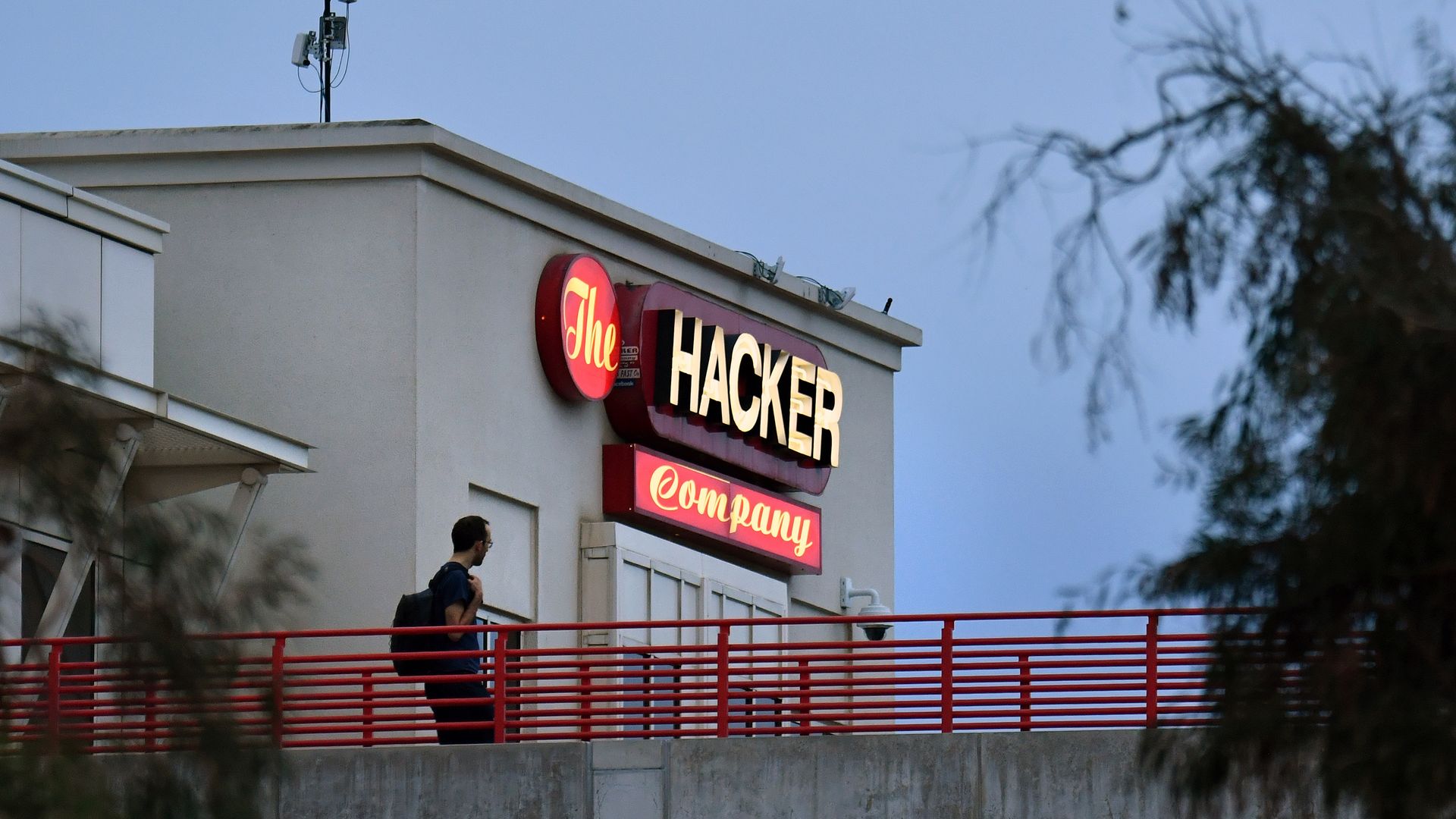A sign at Facbook headquarters that says "The Hacker Company"