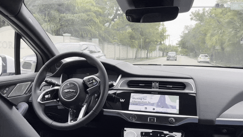 Image shows a Waymo steering wheel spinning without driver.