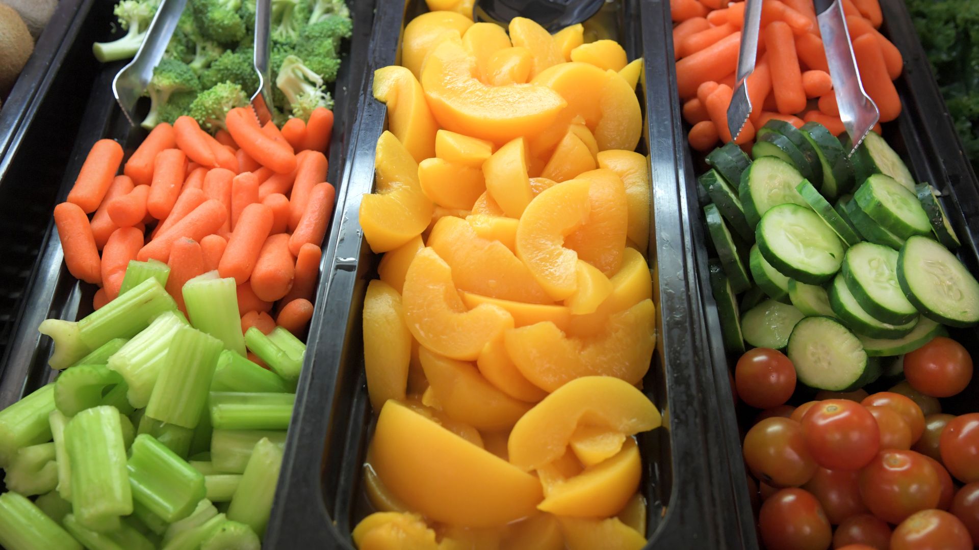 Fruits and vegetables in a cafeteria line