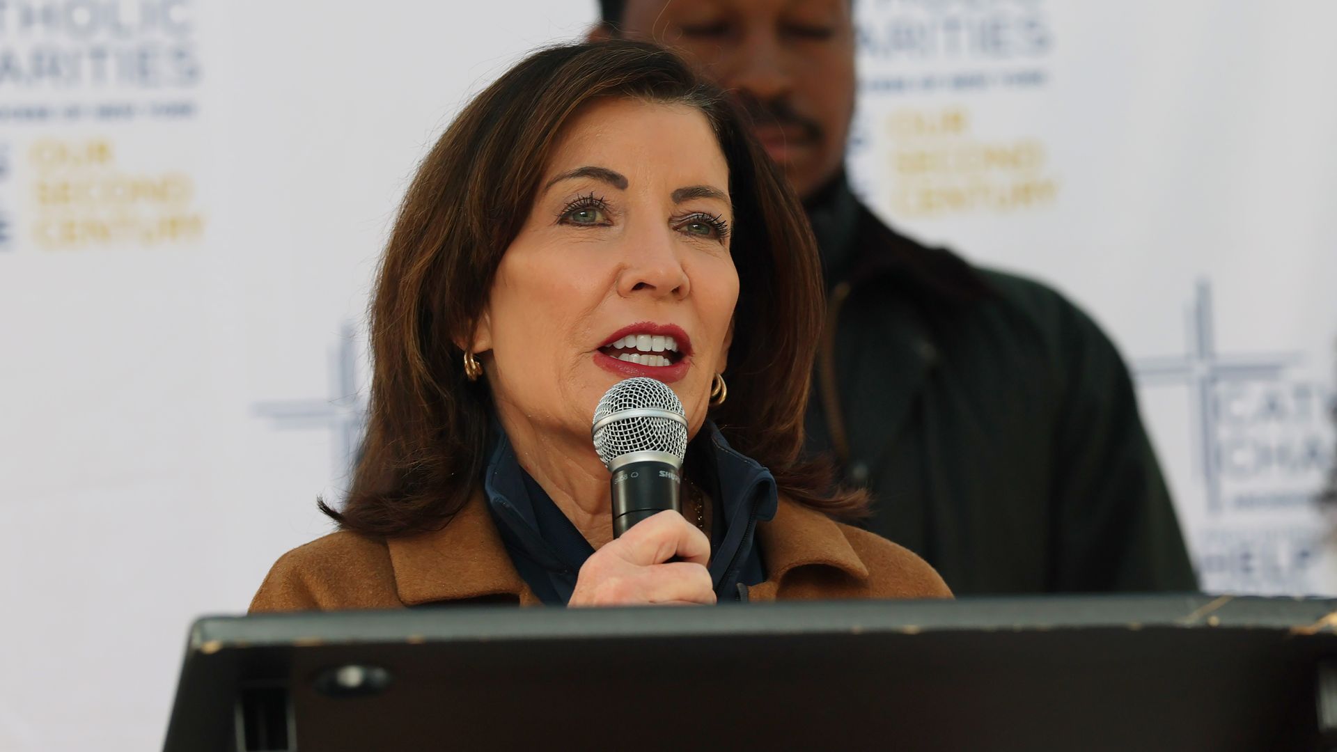 New York Governor Kathy Hochul speaks during a brief press conference as she prepares to hand out Thanksgiving food