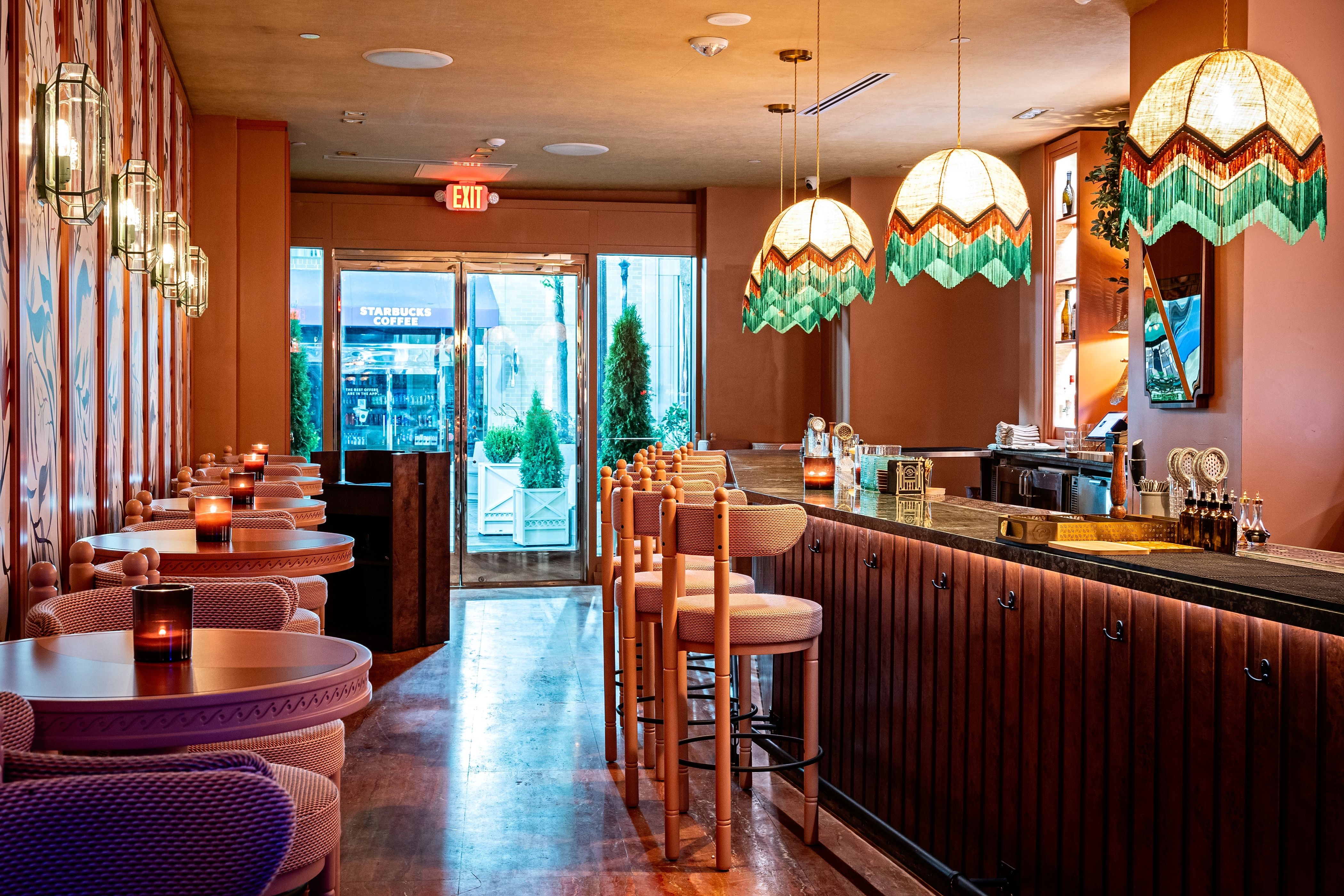A bar area with hanging lanterns 