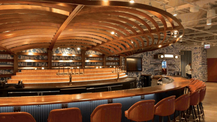 GIF of a train wizzing by a bar window 