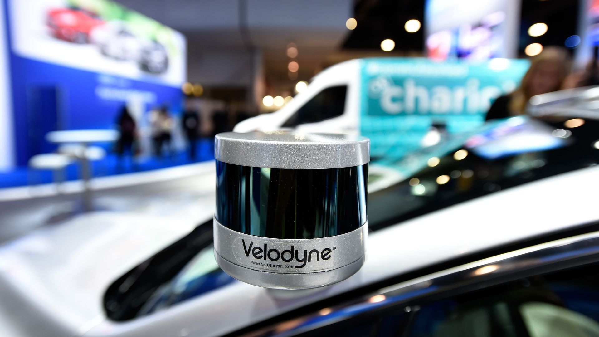 A Velodyne LiDAR sensor is mounted on a Ford Fusion hybrid