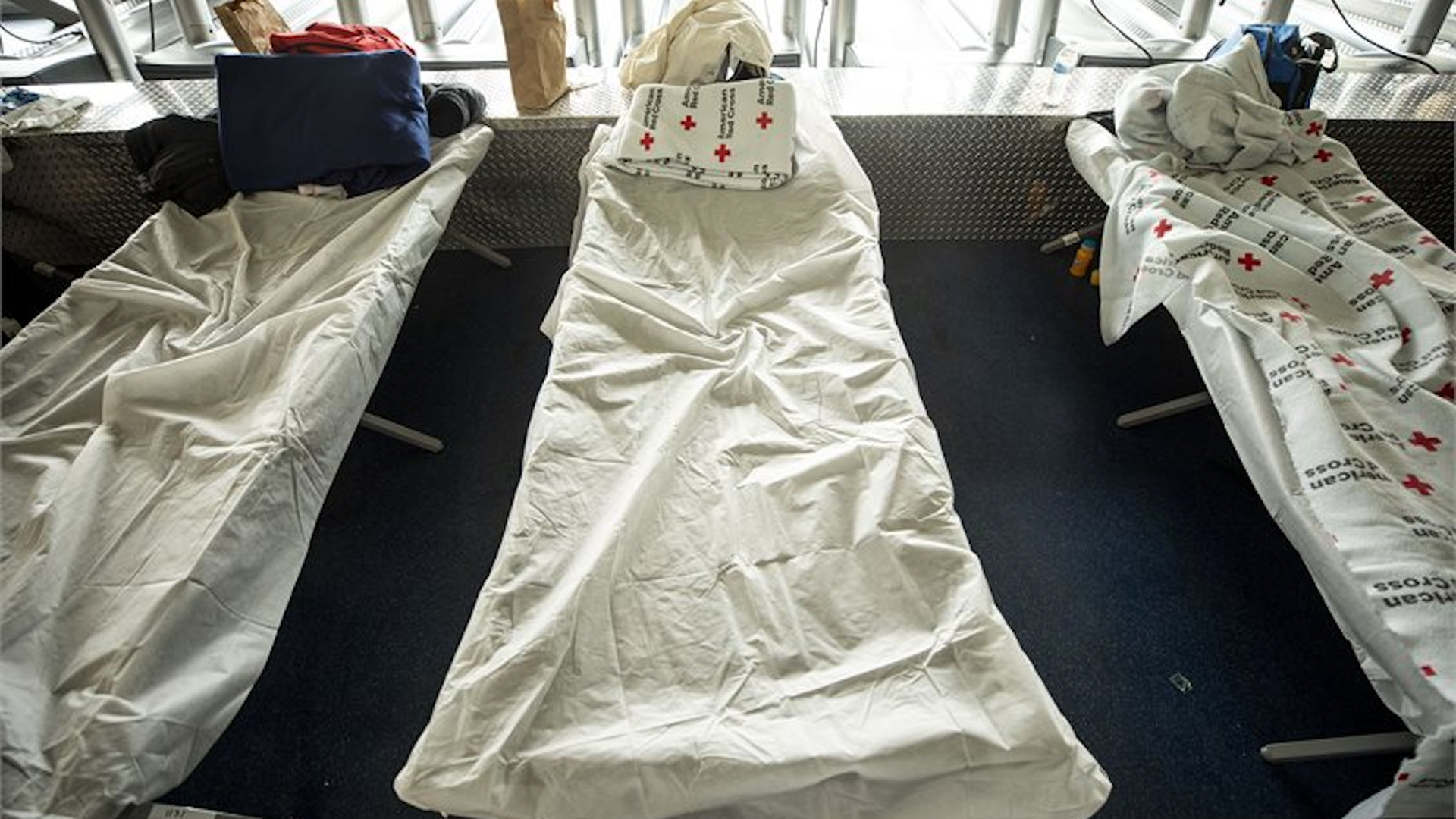 Temporary beds for migrants inside a city-run emergency shelter. Photo: Courtesy of City of Denver