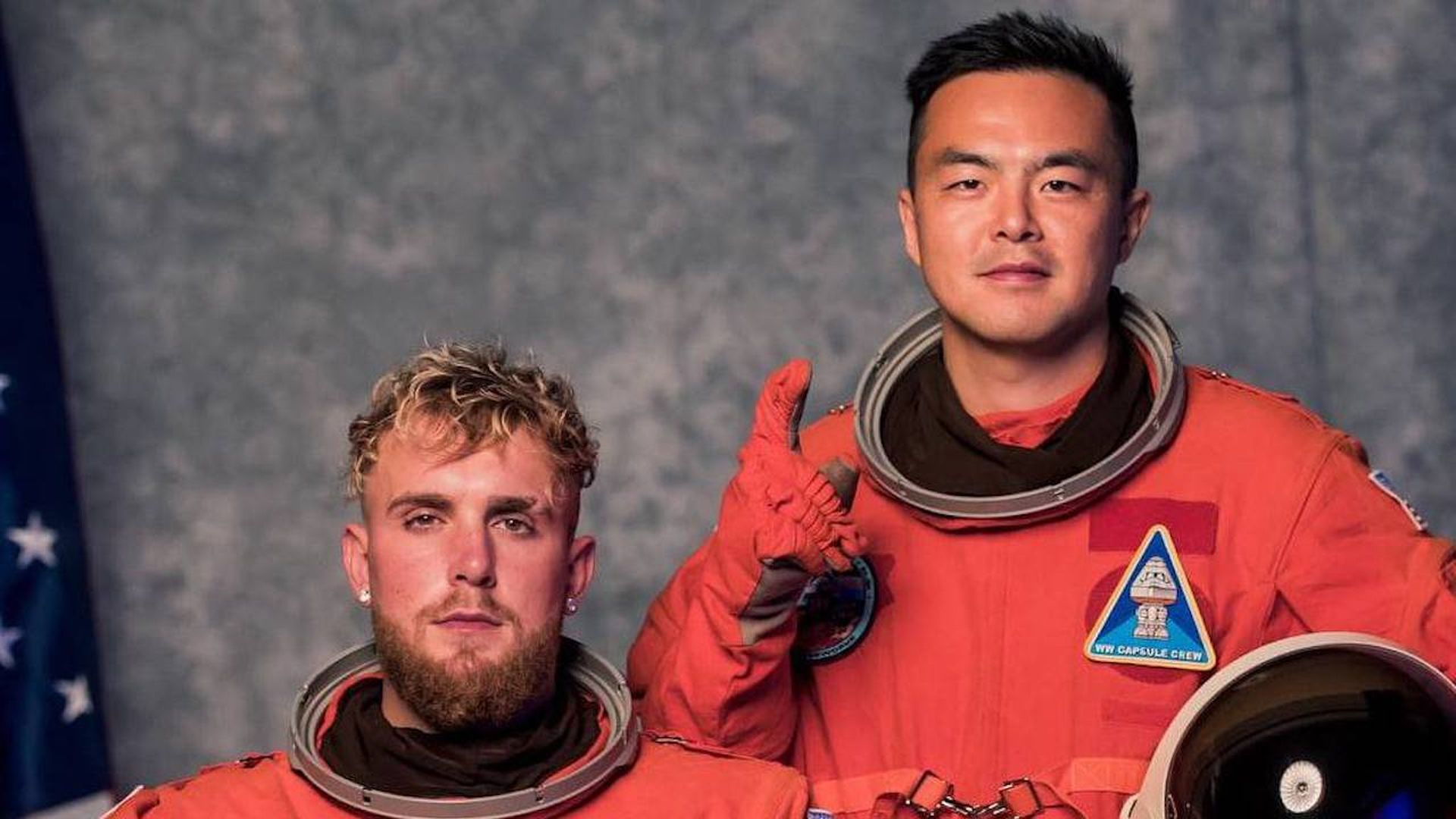 Photo of Jake Paul and Geoffrey Woo in astronaut suits.