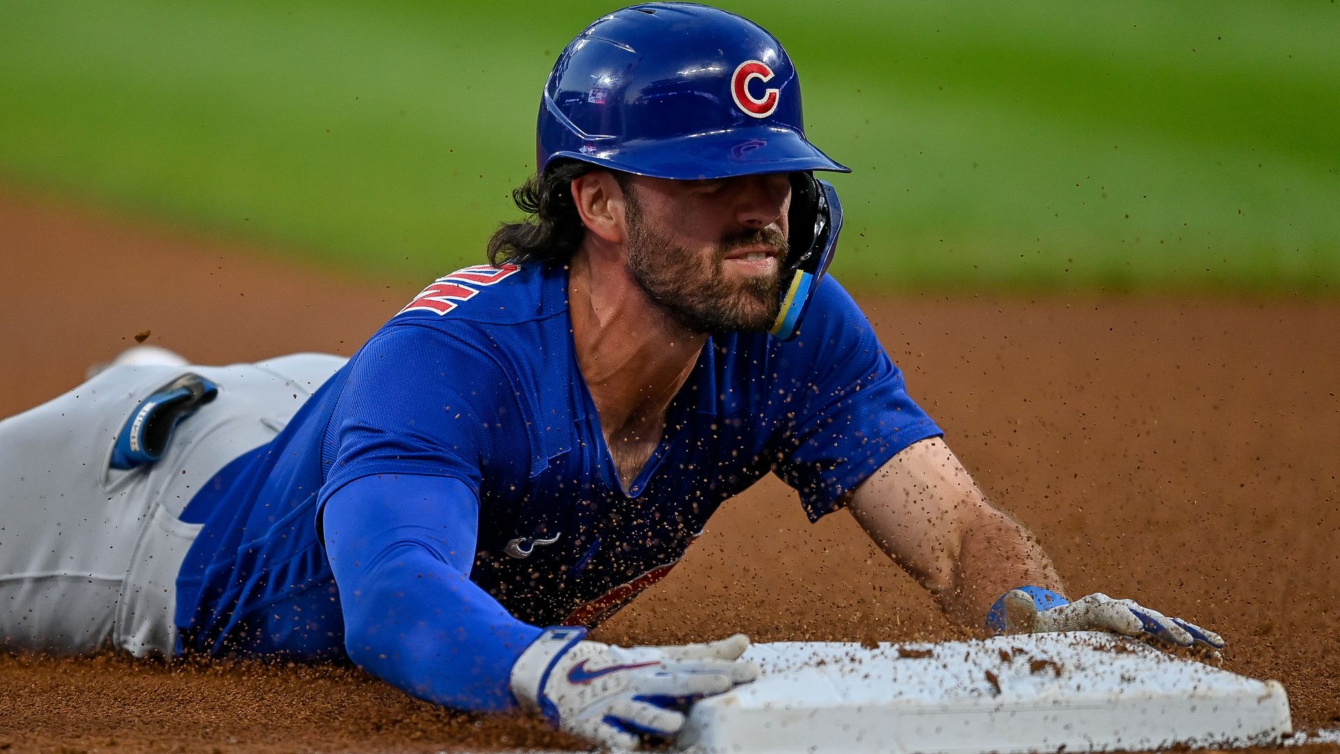 Photo of a baseball player sliding into a base 