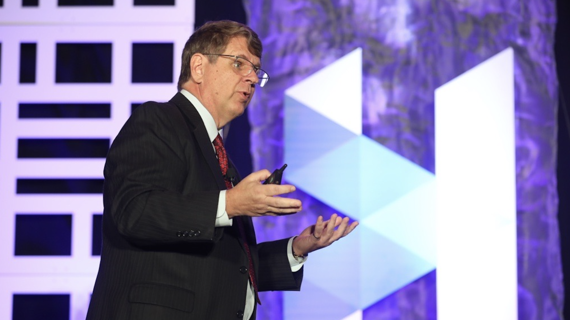 Photo of a man giving a presentation.