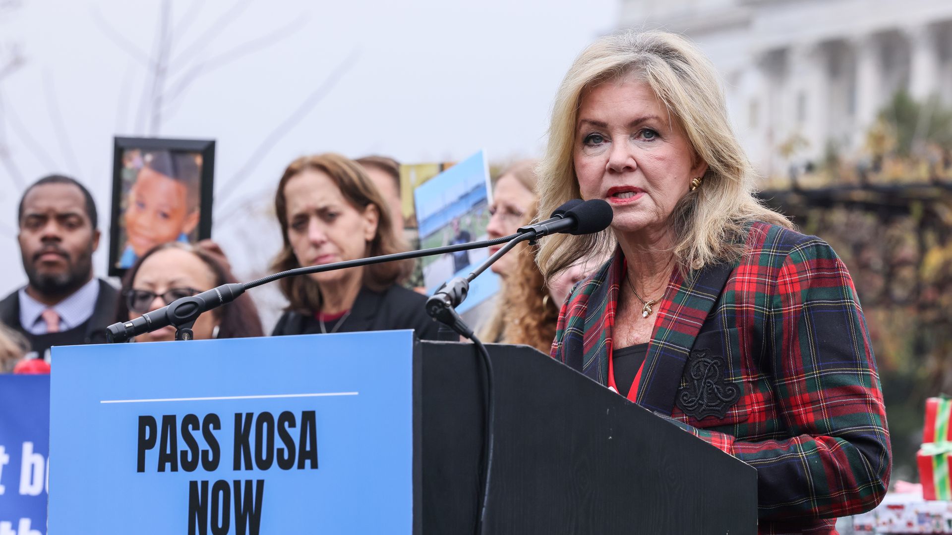 Senator Marsha Blackburn standing at a lectern outside the Capitol 