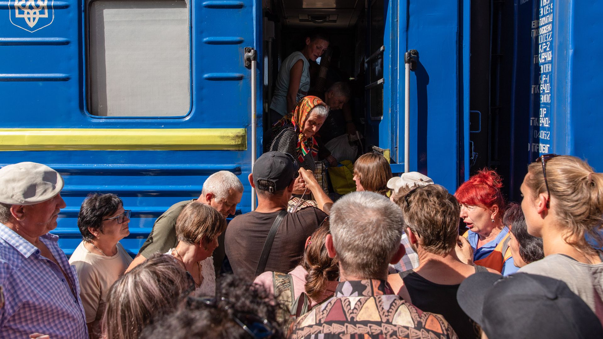 Civilians board the evacuation train in Pokorvsk.