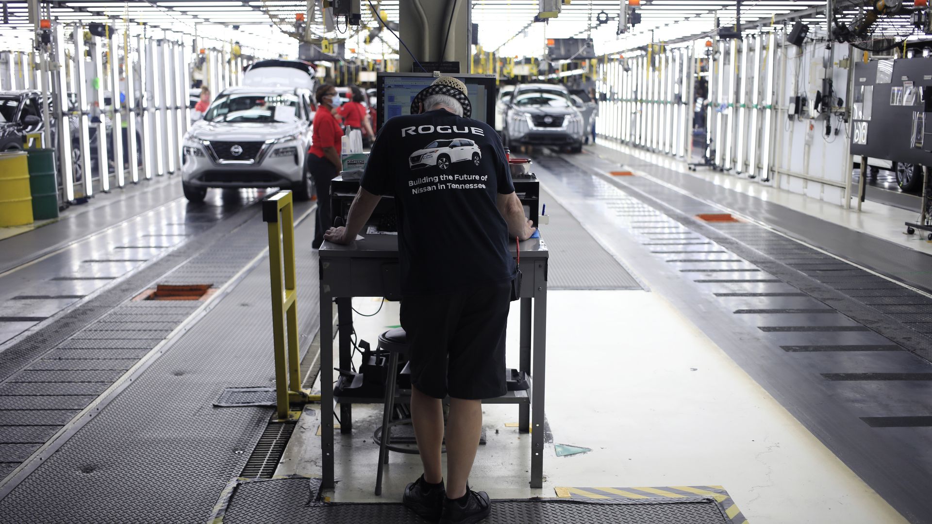 A worker uses a computer on the assembly line at the Nissan Motor Co. manufacturing facility in Smyrna