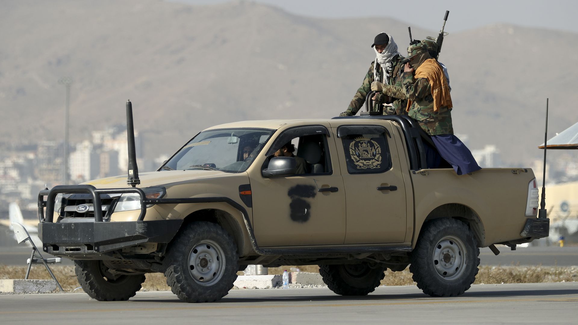  Members of the Taliban movement patrol Kabul airport in  September 
