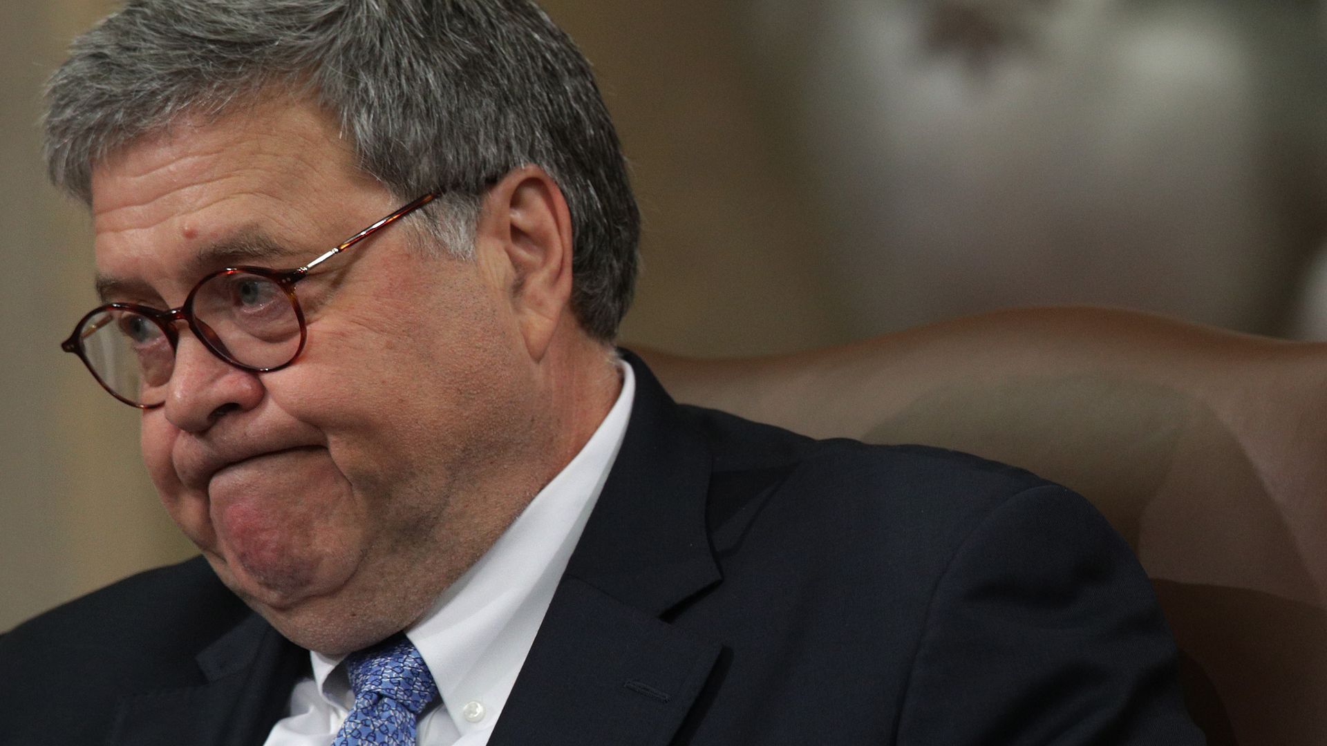 Photo of Attorney General William Barr pursing his lips