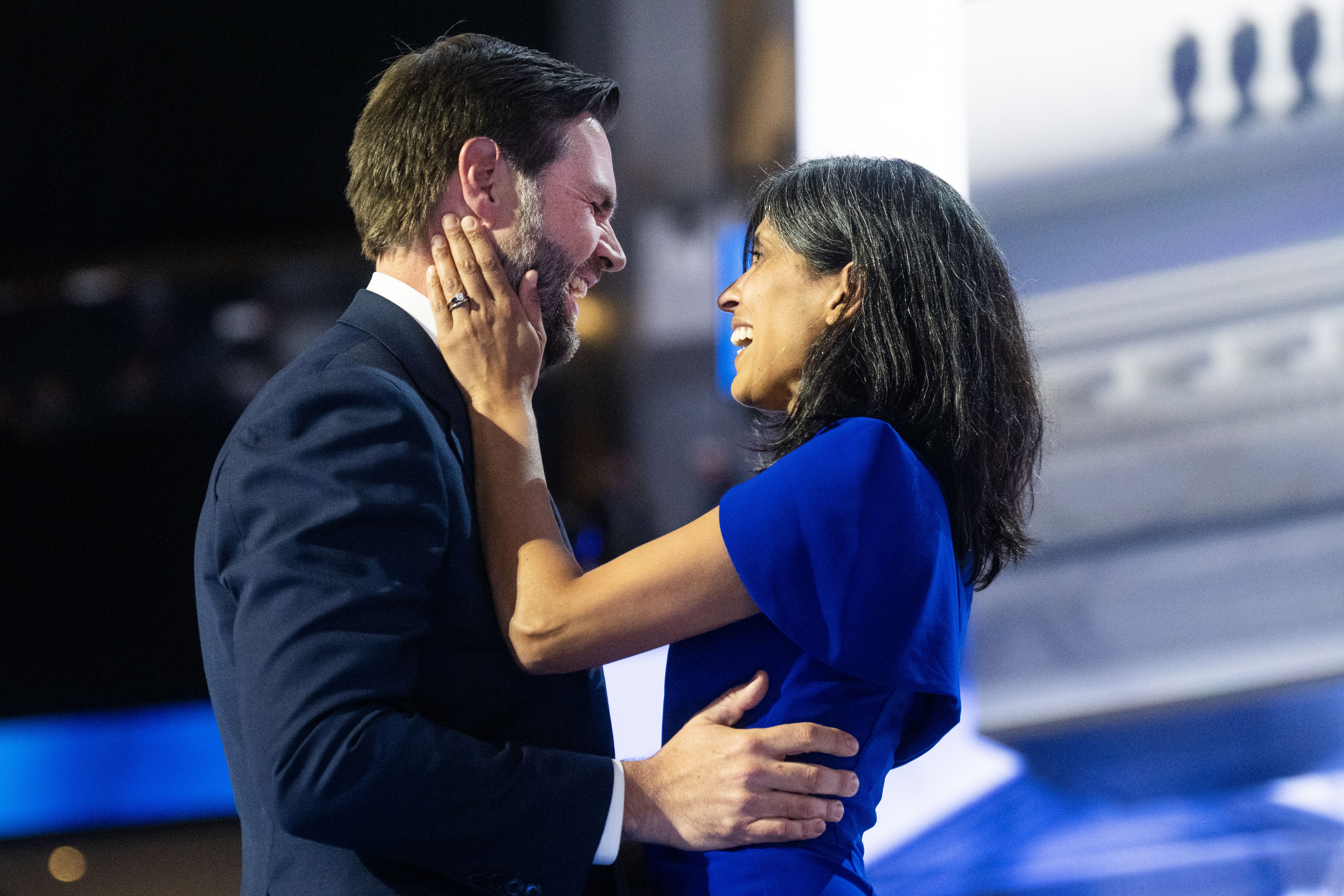 Republican vice presidential nominee J.D. Vance embraces his wife Usha after his convention speech.
