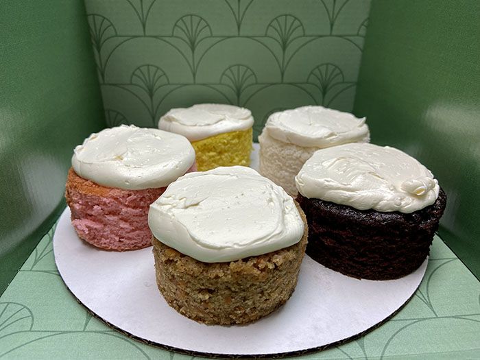 Cake tasting flavors from left to right from top left: lemon, vanilla, chocolate, carrot and pink champagne. 