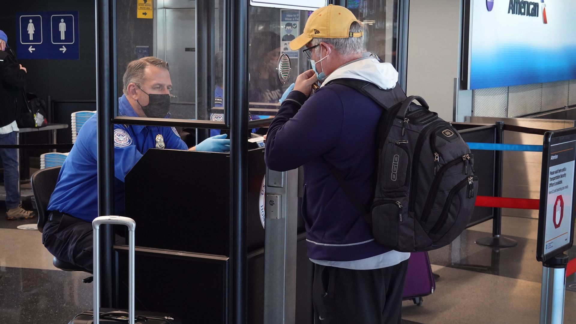 Transportation Security Administration (TSA) workers screen passengers at O'Hare International Airport on November 08, 2021 in Chicago, Illinois.