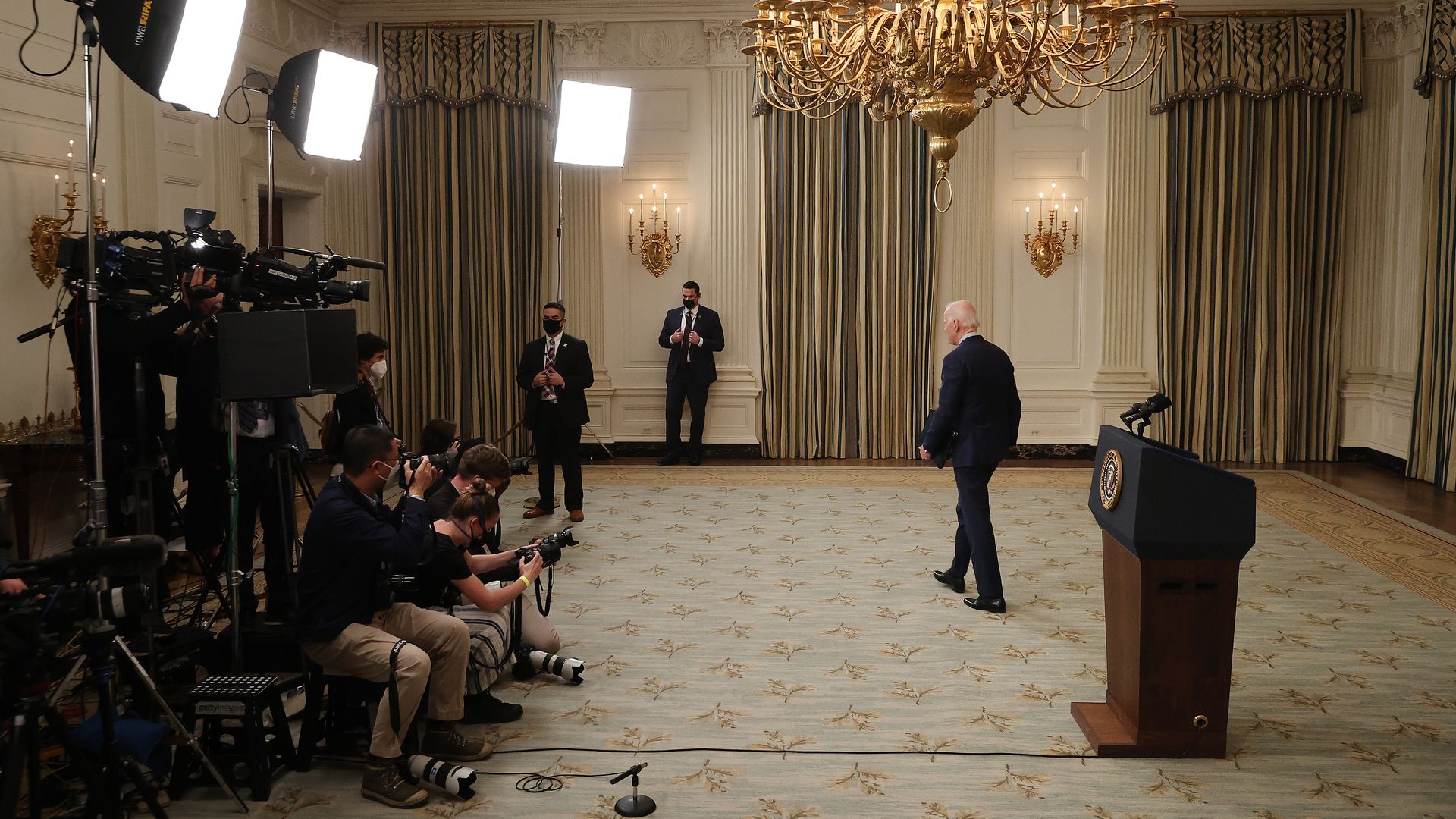 President Biden is seen walking out of the State Dining Room after delivering remarks about the mass shooting in Boulder, Colo.