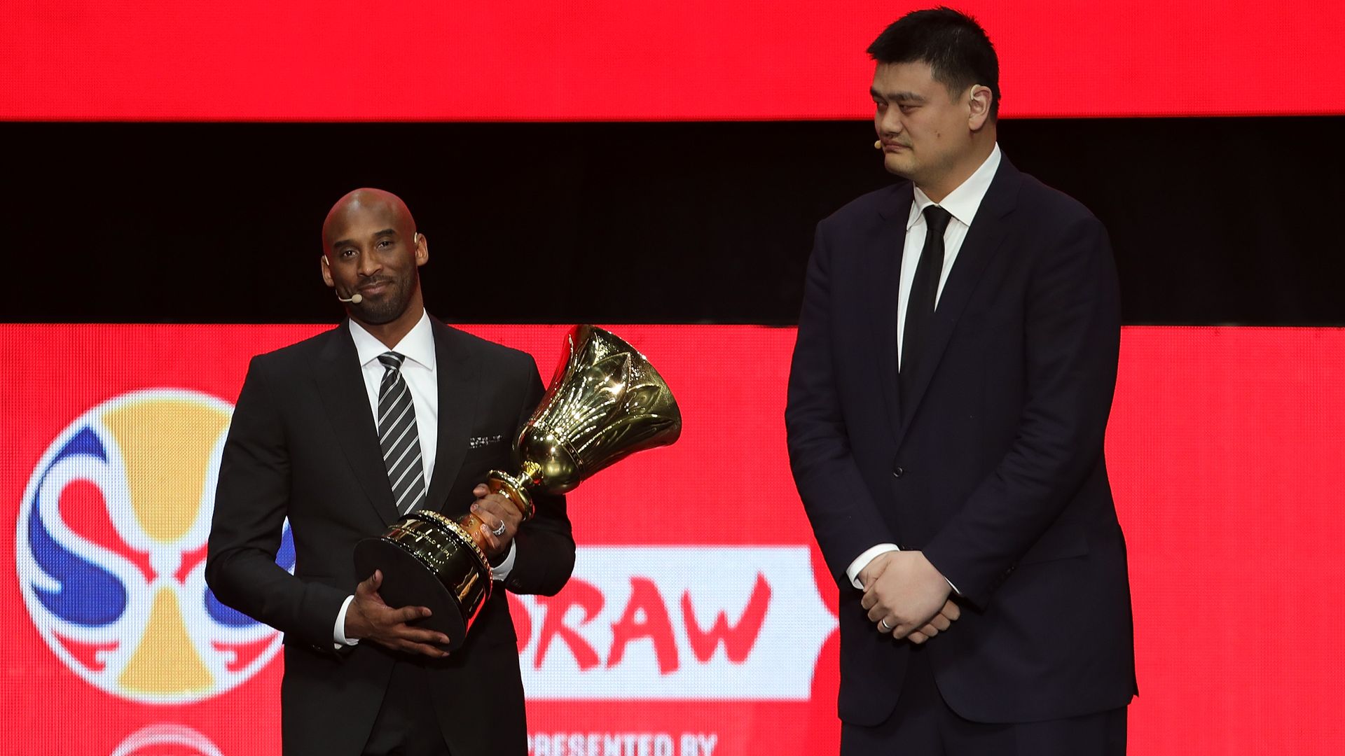 President of the Chinese Basketball Association Yao Ming receives the FBWC Trophy form Kobe Bryant during the FIBA Basketball World Cup 2019 Draw Ceremony at Shenzhen Bay Arena.