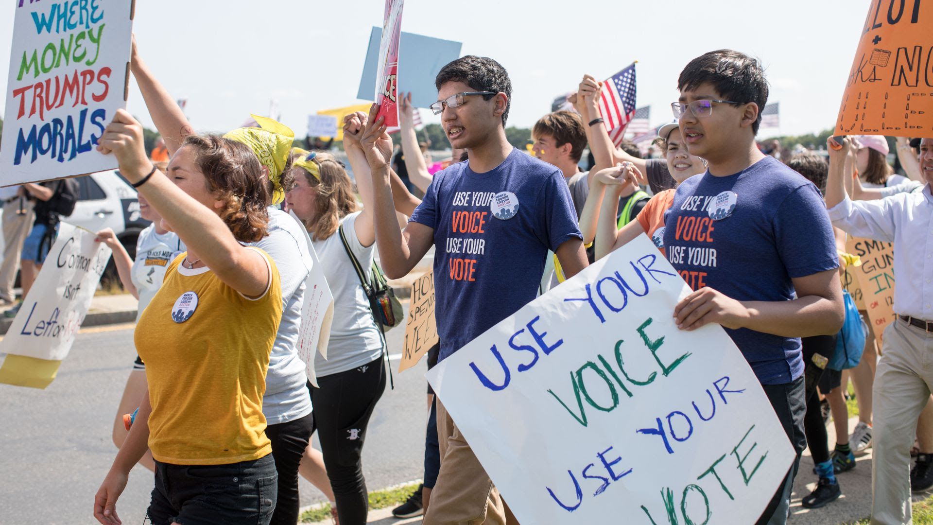 Parkland students carry signs in the streets urging people to vote