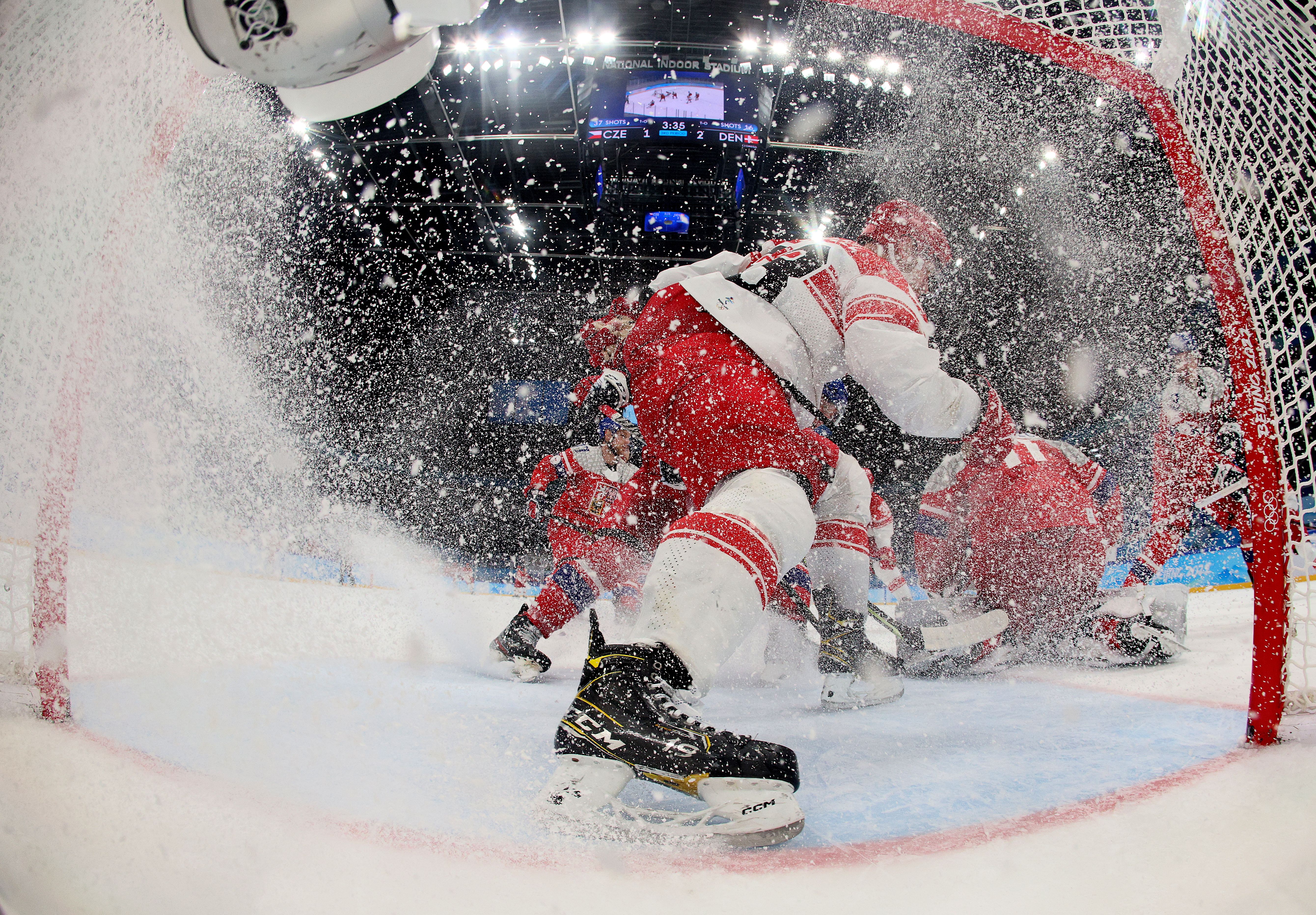 BEIJING, CHINA - FEBRUARY 09: Forward Patrick Russell #63 of Team Denmark skates at the net as goalkeeper Simon Hrubec #11 of Team Czech Republic defends in the third period during the Men's Preliminary Round Group B match on Day 5 of the Beijing 2022 Winter Olympic Games at National Indoor Stadium 